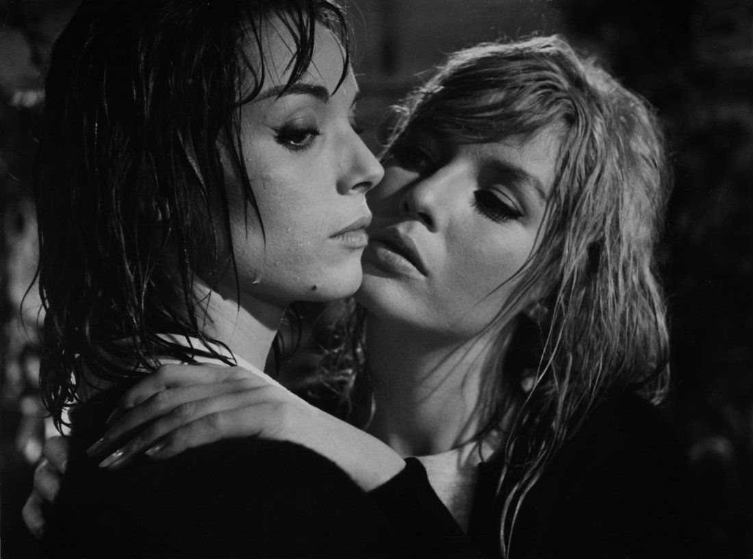 two women in Blood and Roses the lesbian vampire movie embrace each other in black and white