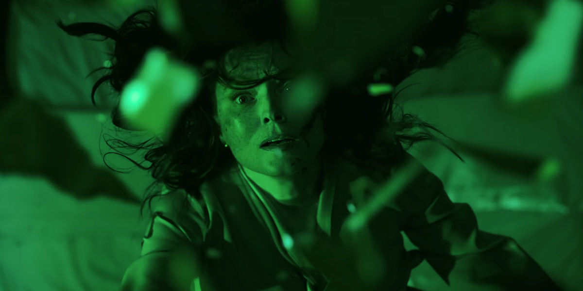 Tamerlane falling among glass shards in green light