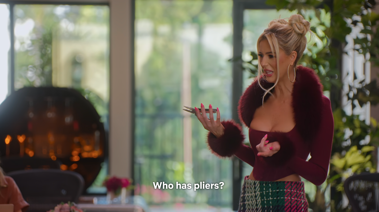 Emma Hernan, a real estate agent on Netflix’s Selling Sunset, pulls pliers out of her designer handbag 