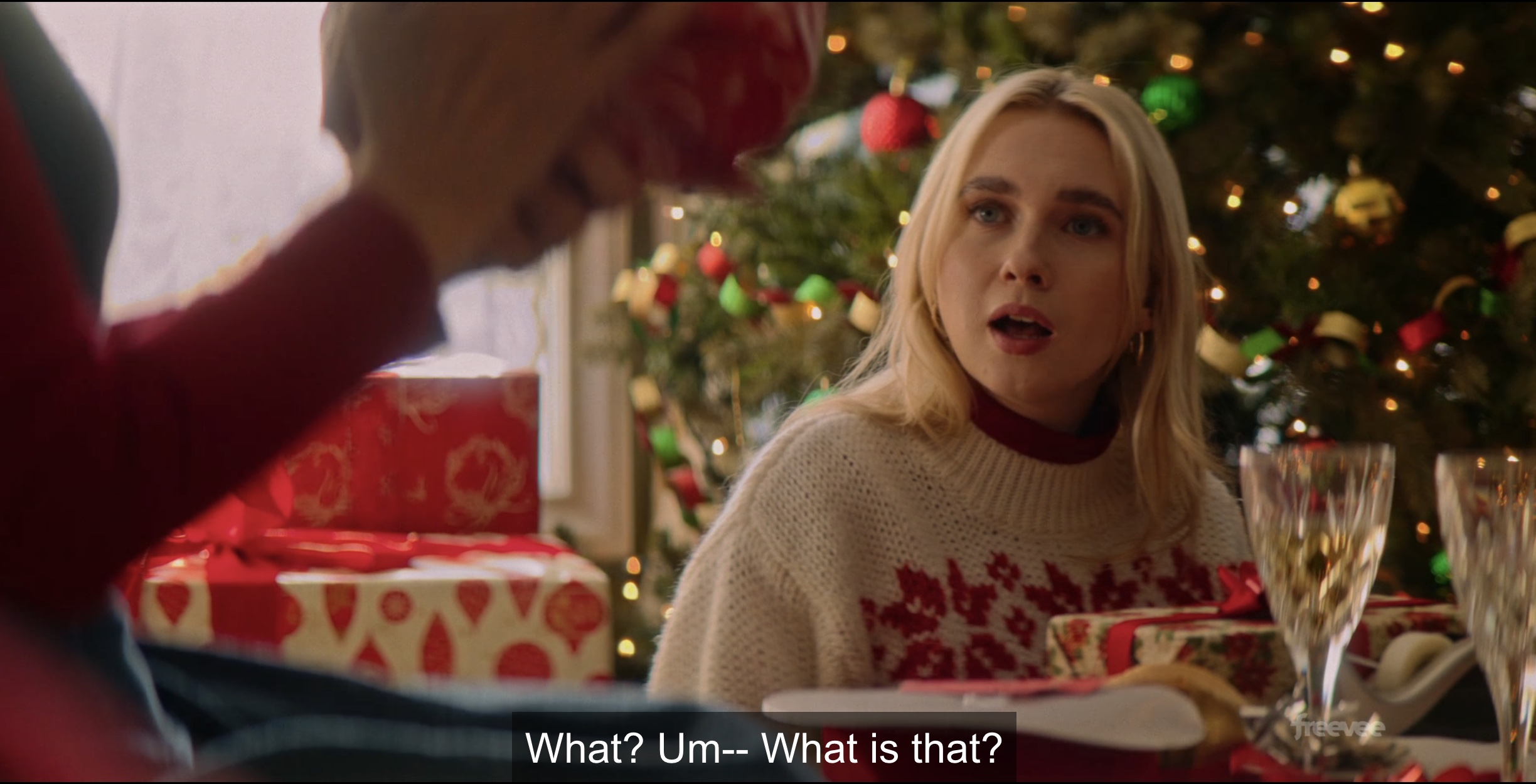lesbian in chirstmas sweater asking "what is that?"