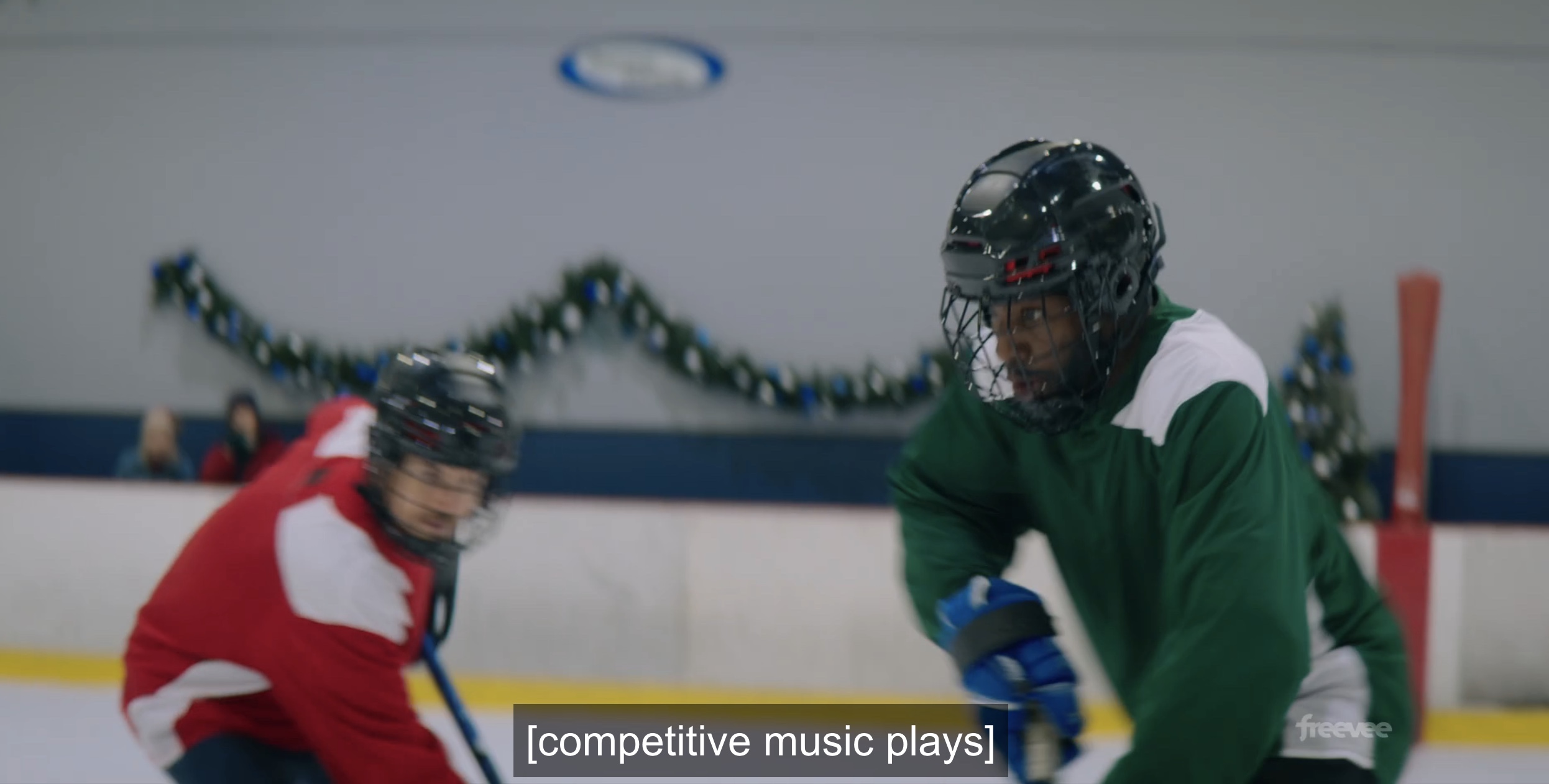 two men play hockey while "competitive music plays"