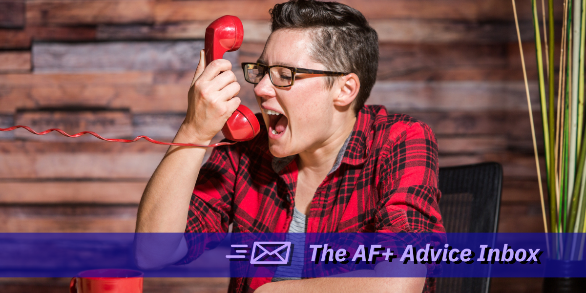 a photo of a white butch lesbian wearing a red and black plaid button up shirt, with short brown hair, yelling into a red corded phone. text at the bottom reads 
