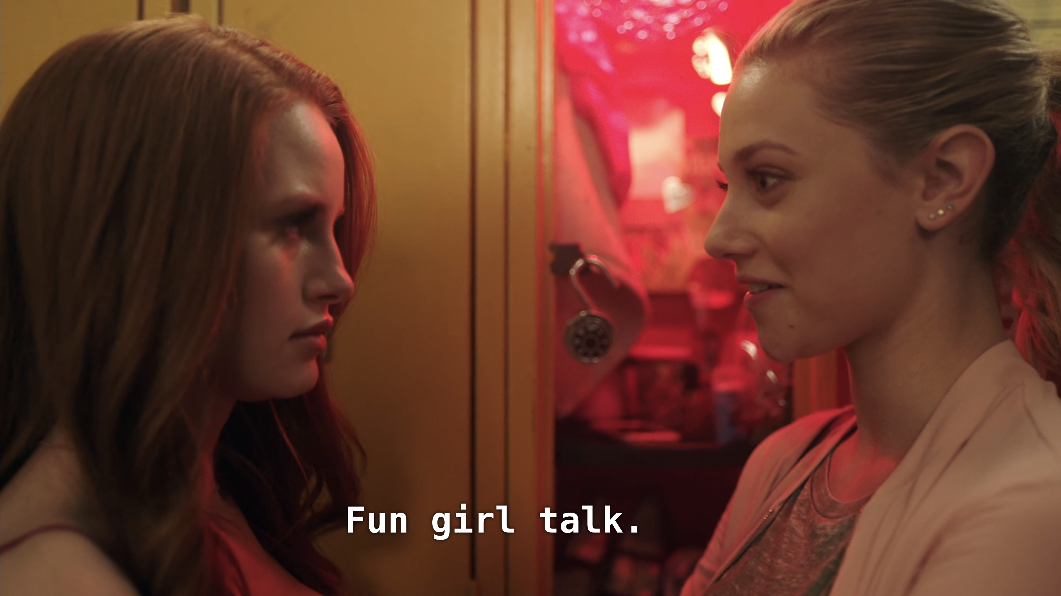 Cheryl and Betty face off by a locker. Betty: Fun girl talk.