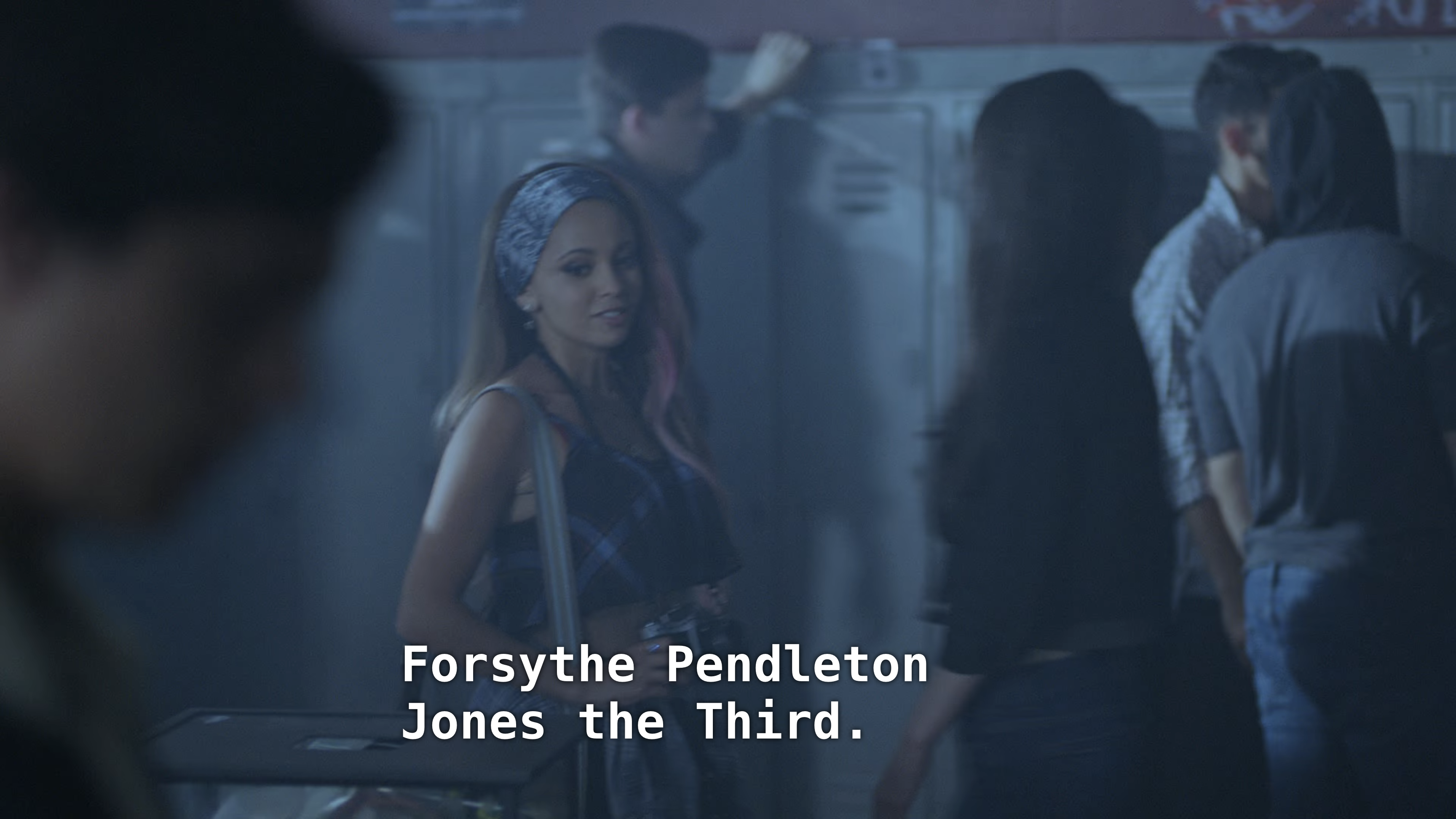 A girl with dyed hair holds a camera and talks to Jughead. "Forsythe Pendleton Jones the Thurd"
