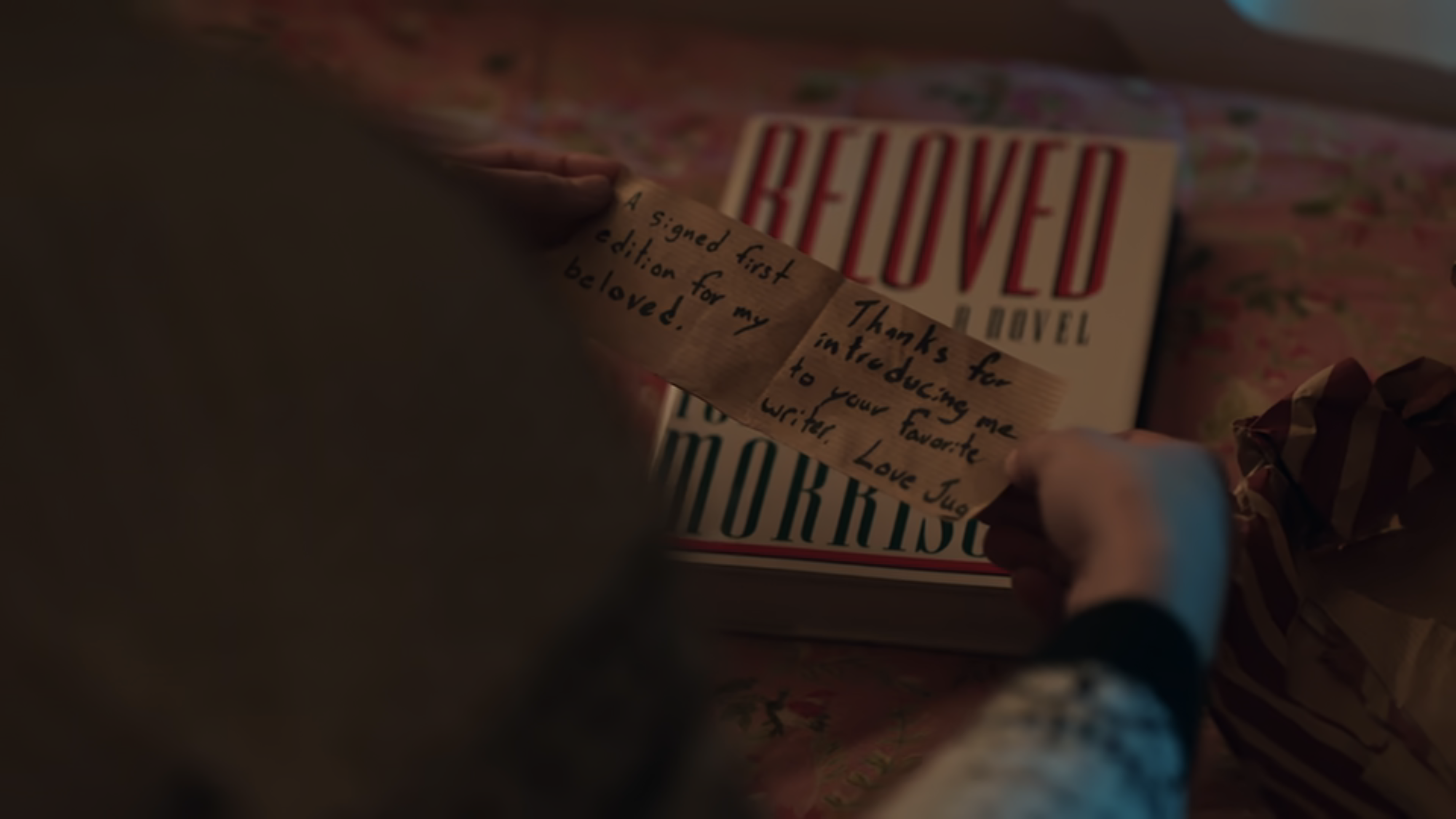 A close up of a first edition of Beloved with a note that reads: A signed first edition for my beloved. Thanks for introducing me to your favorite.