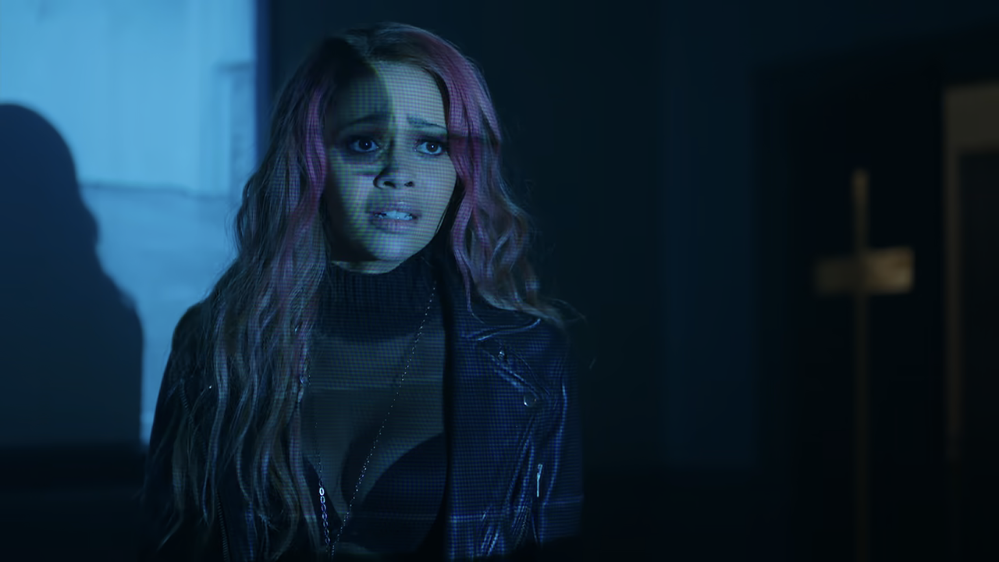 Toni in a see through top with a visible bra