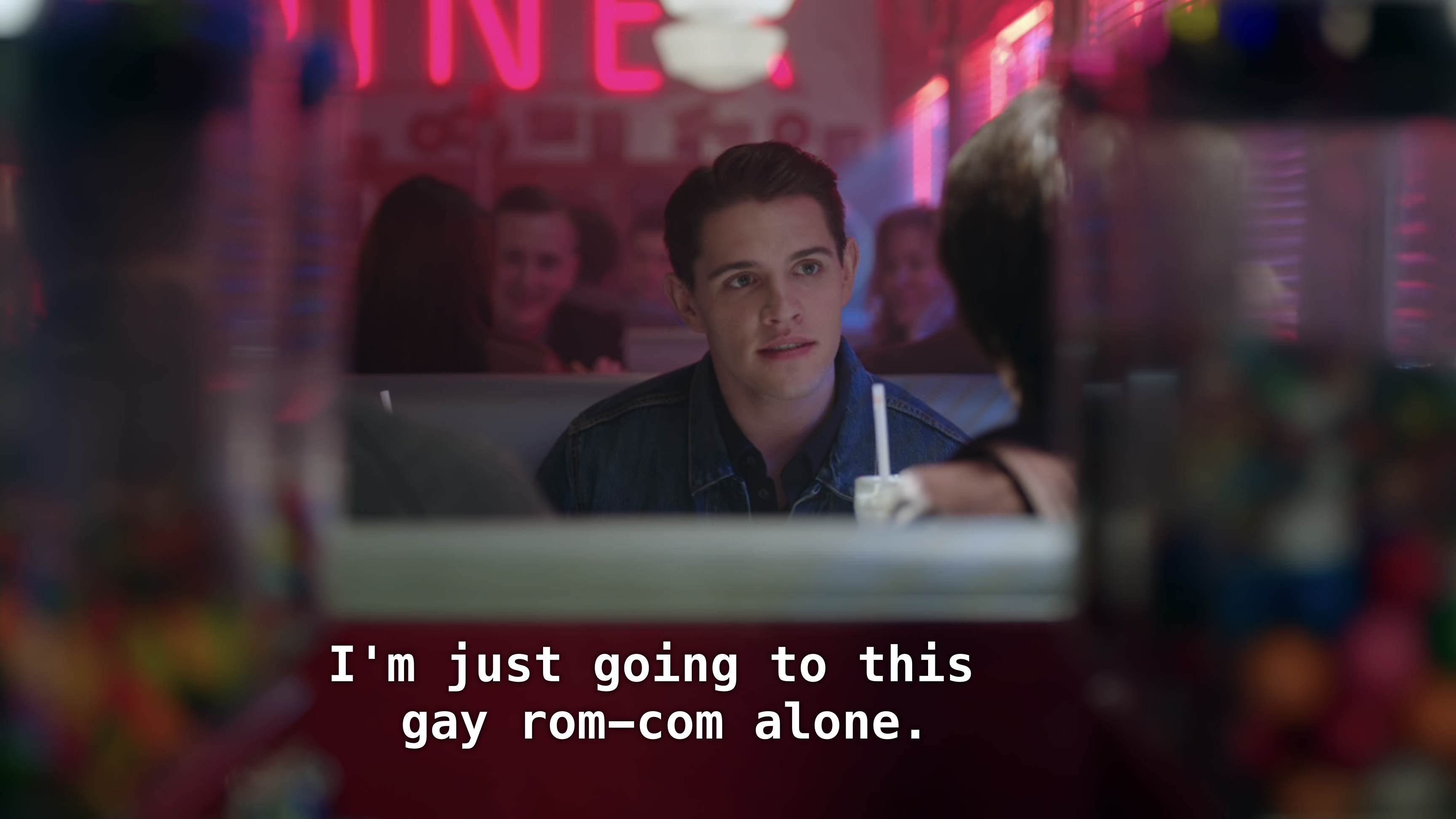Kevin sits in a diner booth. "I'm just going to this gay rom-com alone."