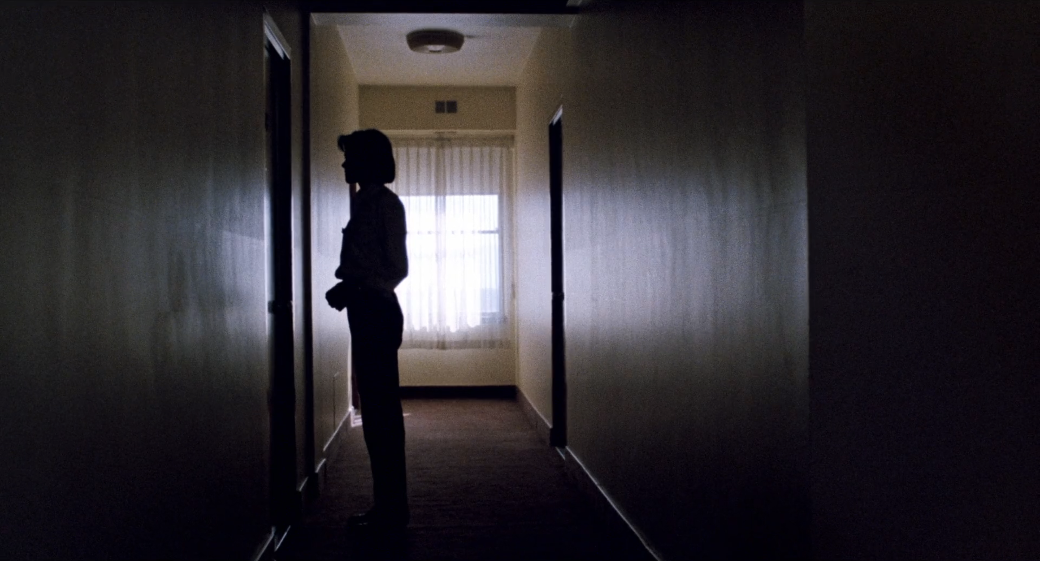 Cay stands at Vivian's door.