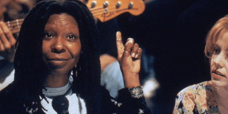 Whoopi Goldberg points and smiles in Boys on the Side