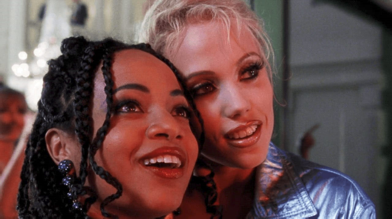 A close up of Elizabeth Berkley and Gina Rivera in Showgirls