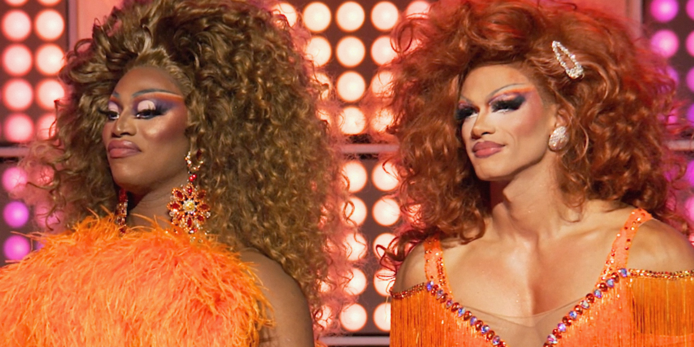 Drag Race 1613 recap: Sapphira in orange stands next to the dancer she put in drag