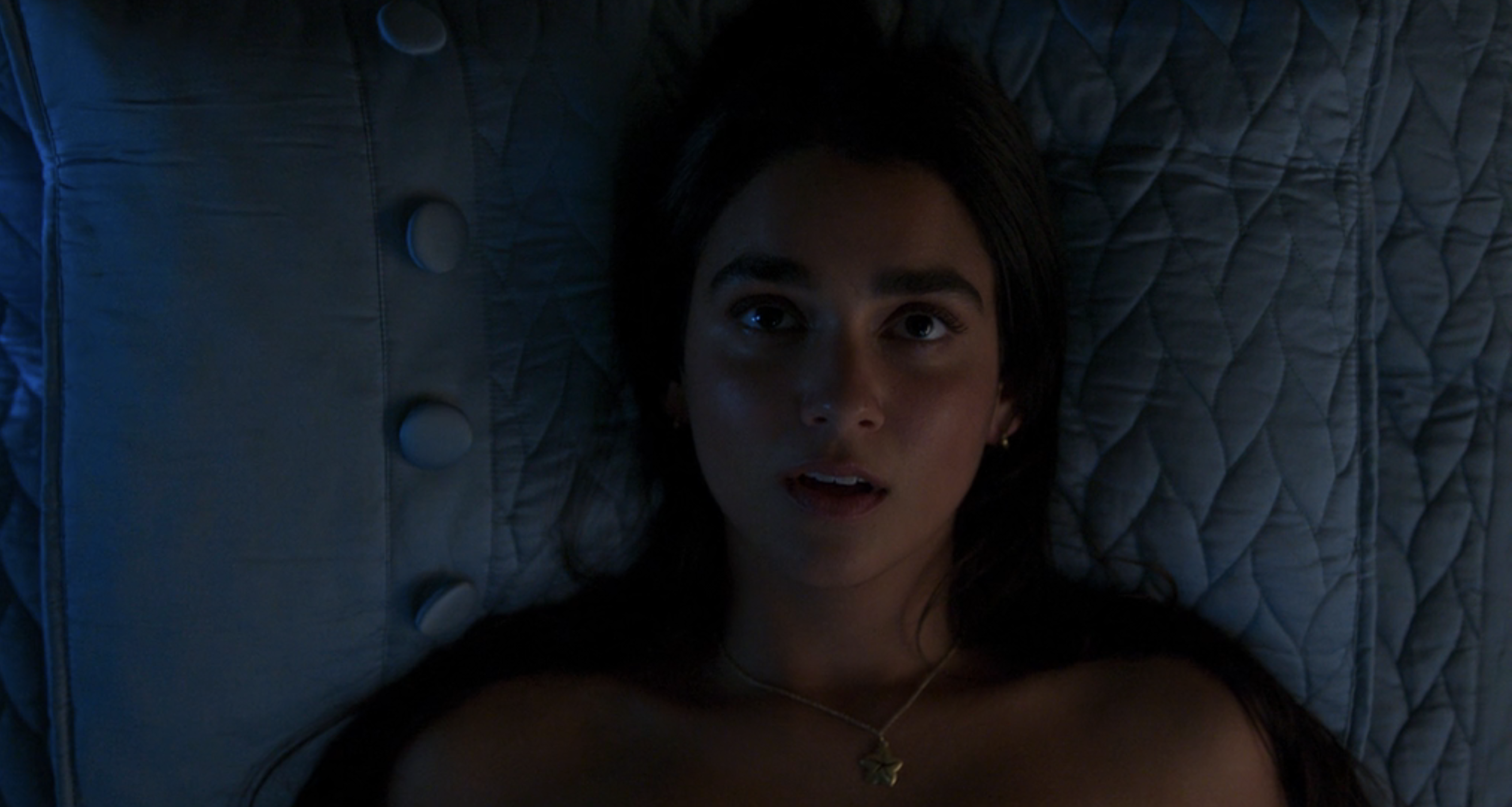 Marian in a bed in Drive-Away Dolls