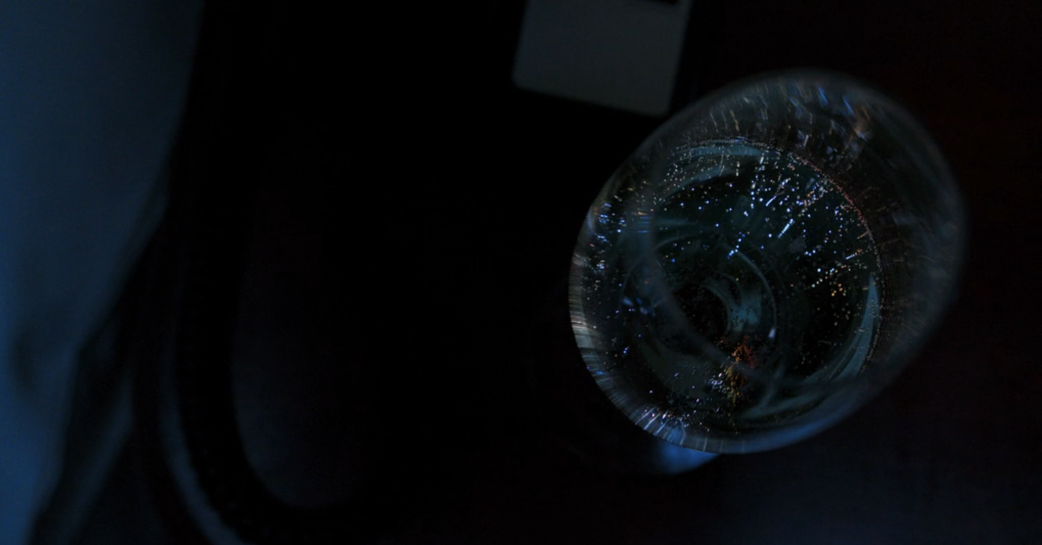 a glass of bubbly champagne in Drive-Away Dolls
