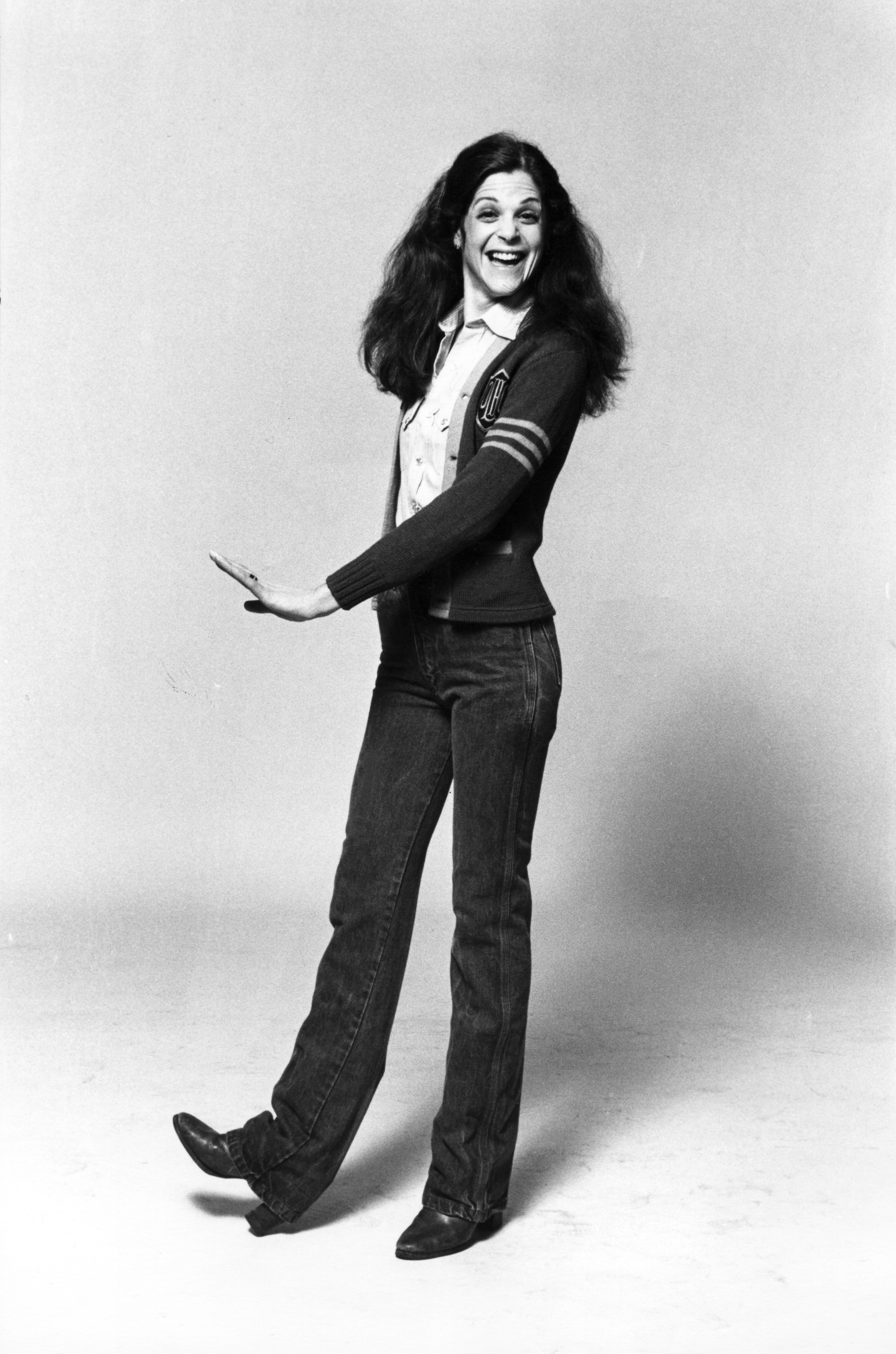 Portrait of American actress and comedienne Gilda Radner (1946 - 1989) as she poses against a white background, New York, New York, late 1970s.