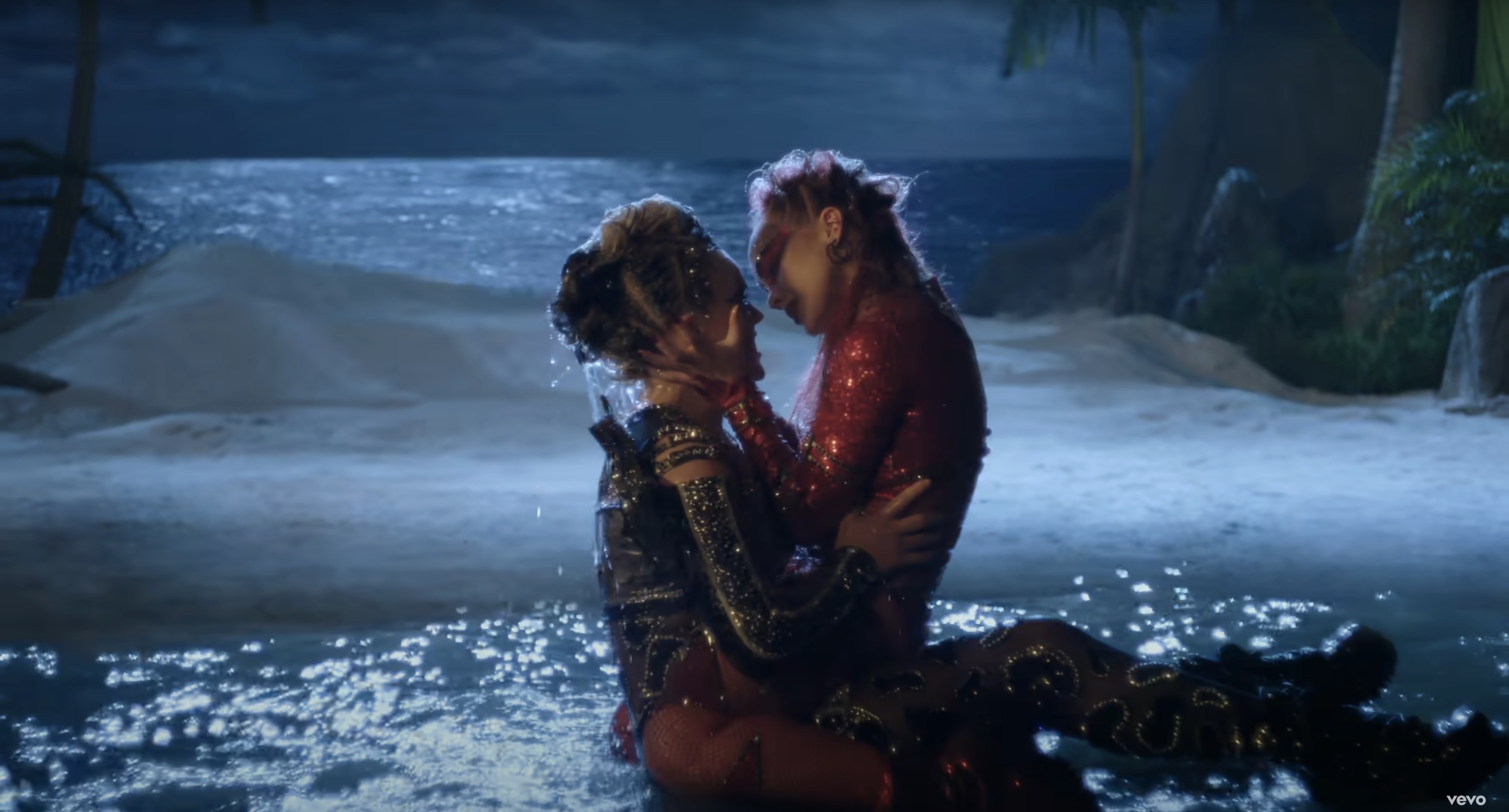jojo and girl making out on an island
