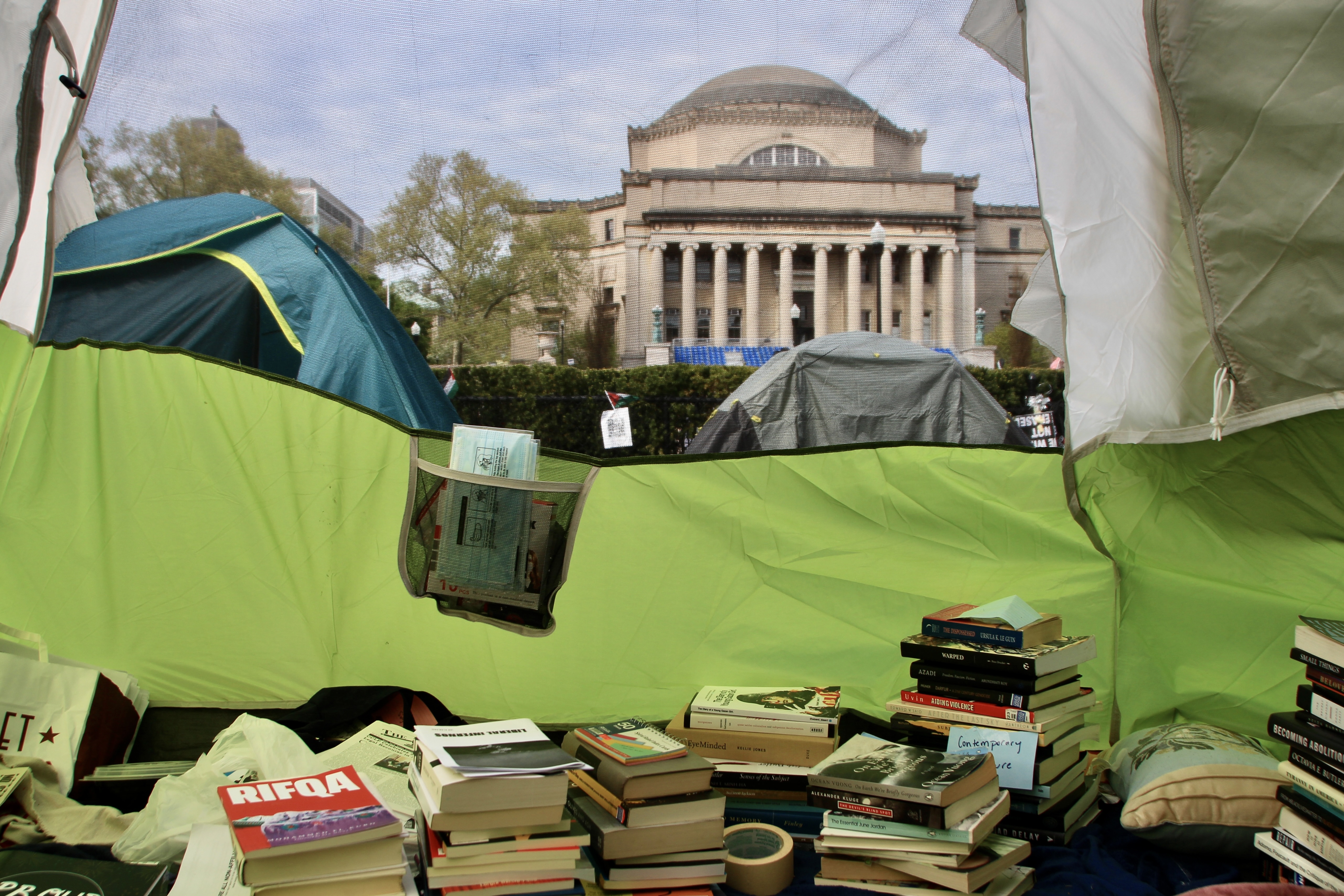 A library set up inside a tent in the “Gaza Solidarity Encampment” at Columbia University. Photo by Mukta Joshi