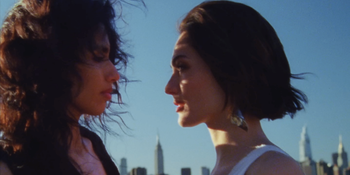 two women gaze into each other's eyes in the 
