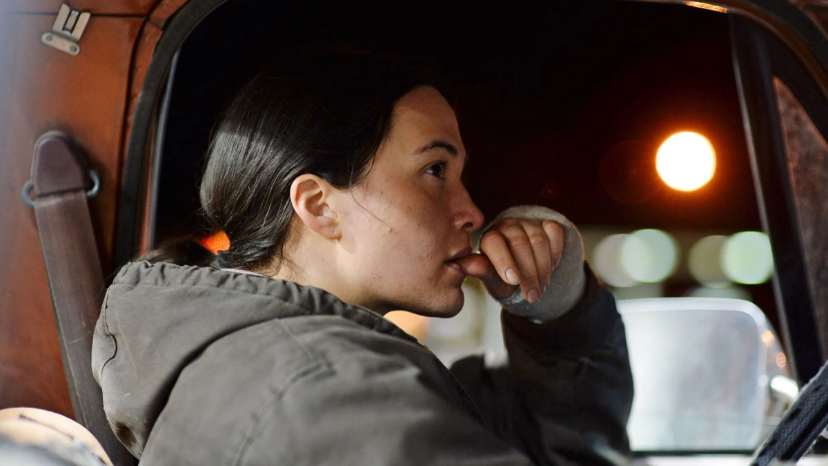 A close up of Lily Gladstone driving a truck.