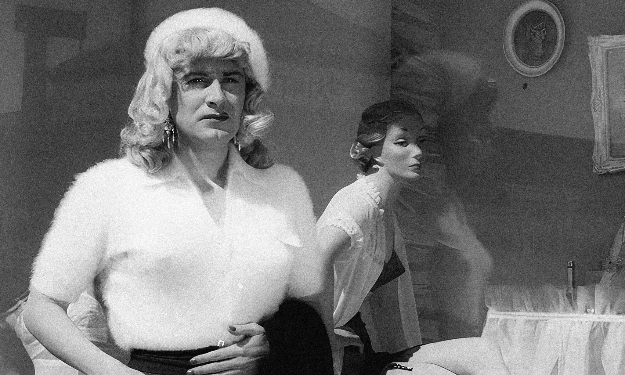 Shirley Wood in an angora sweater stands next to a mannequin