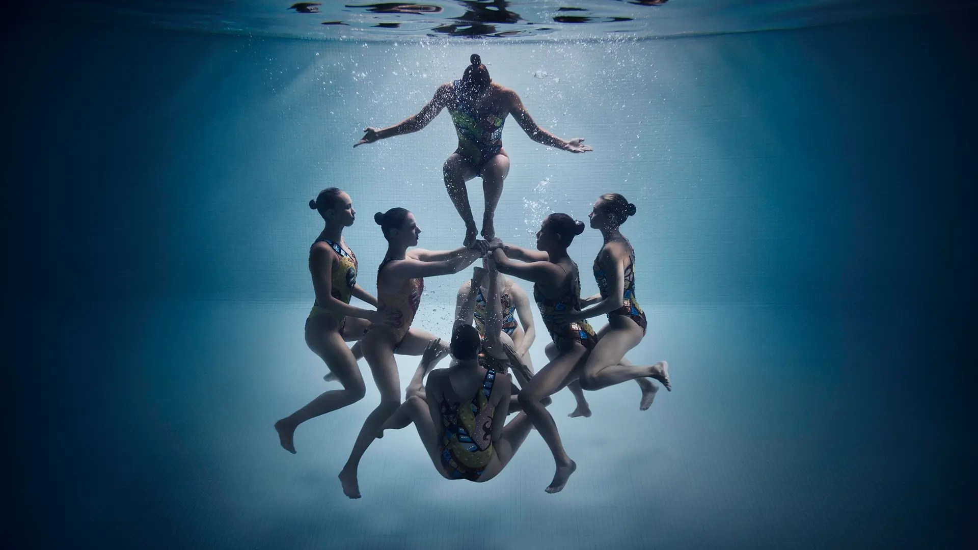 synchronized swimmers underwater
