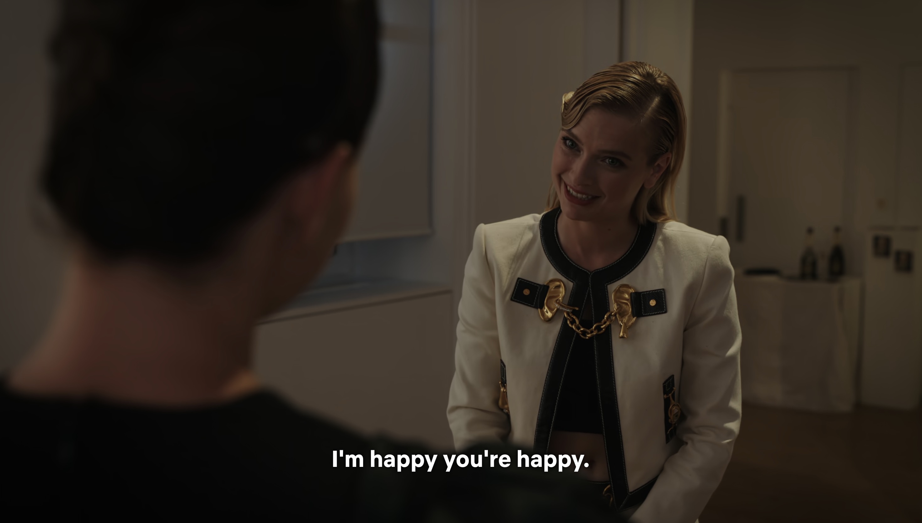 Camille is smiling and says she is happy that Sofia is happy