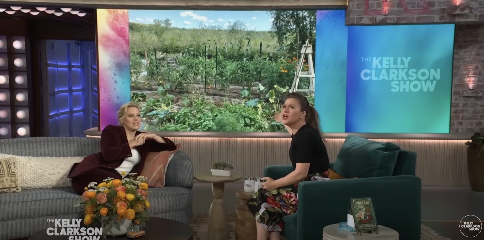 Kelly Clarkson marveling at Kate McKinnon's garden