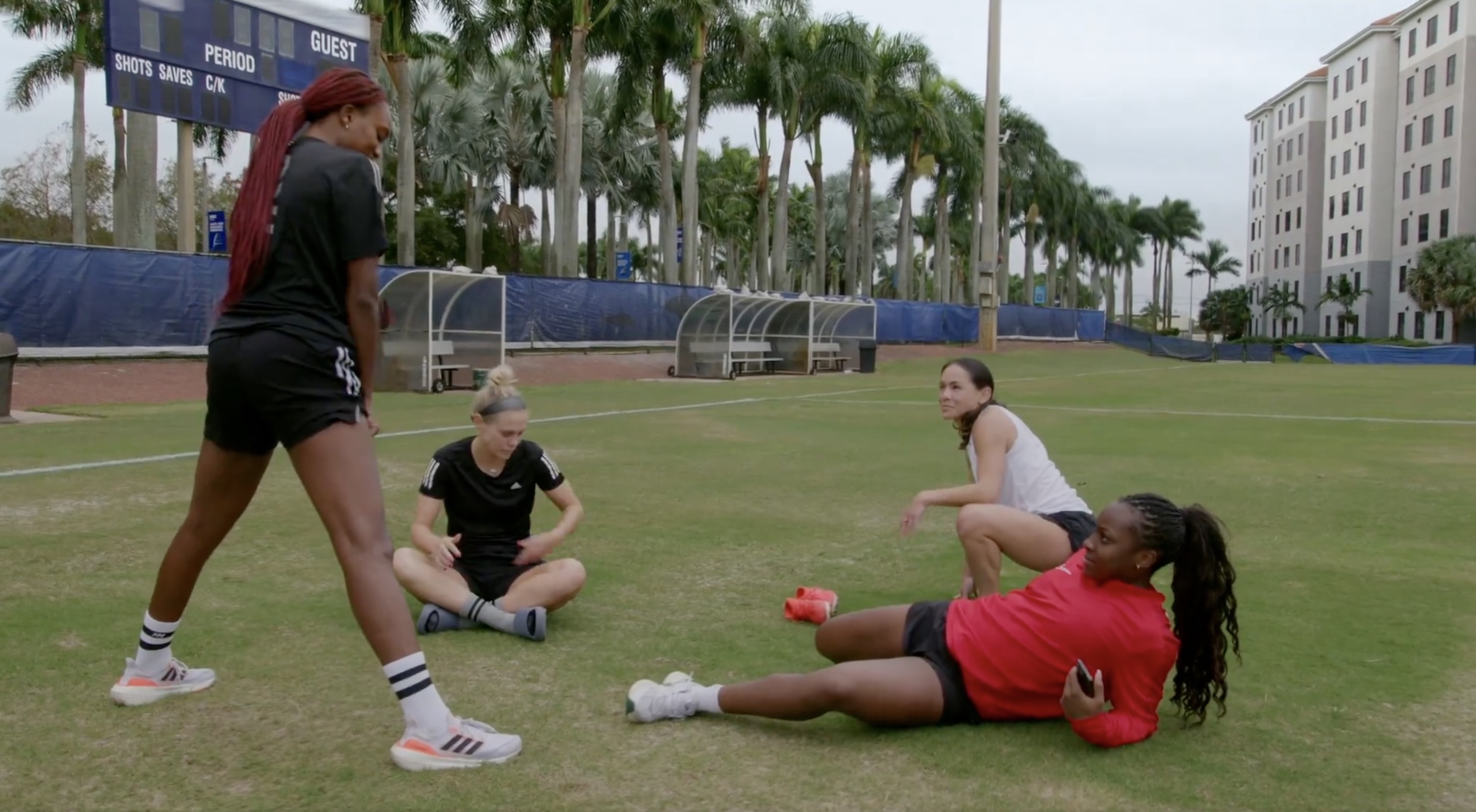 girls stretching on the field
