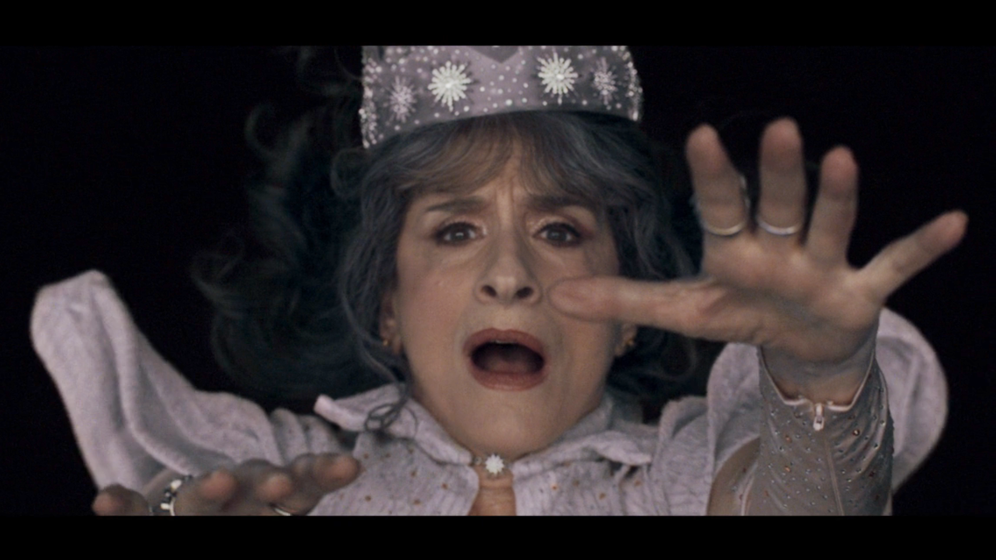 Lilia dressed as Glinda and falling