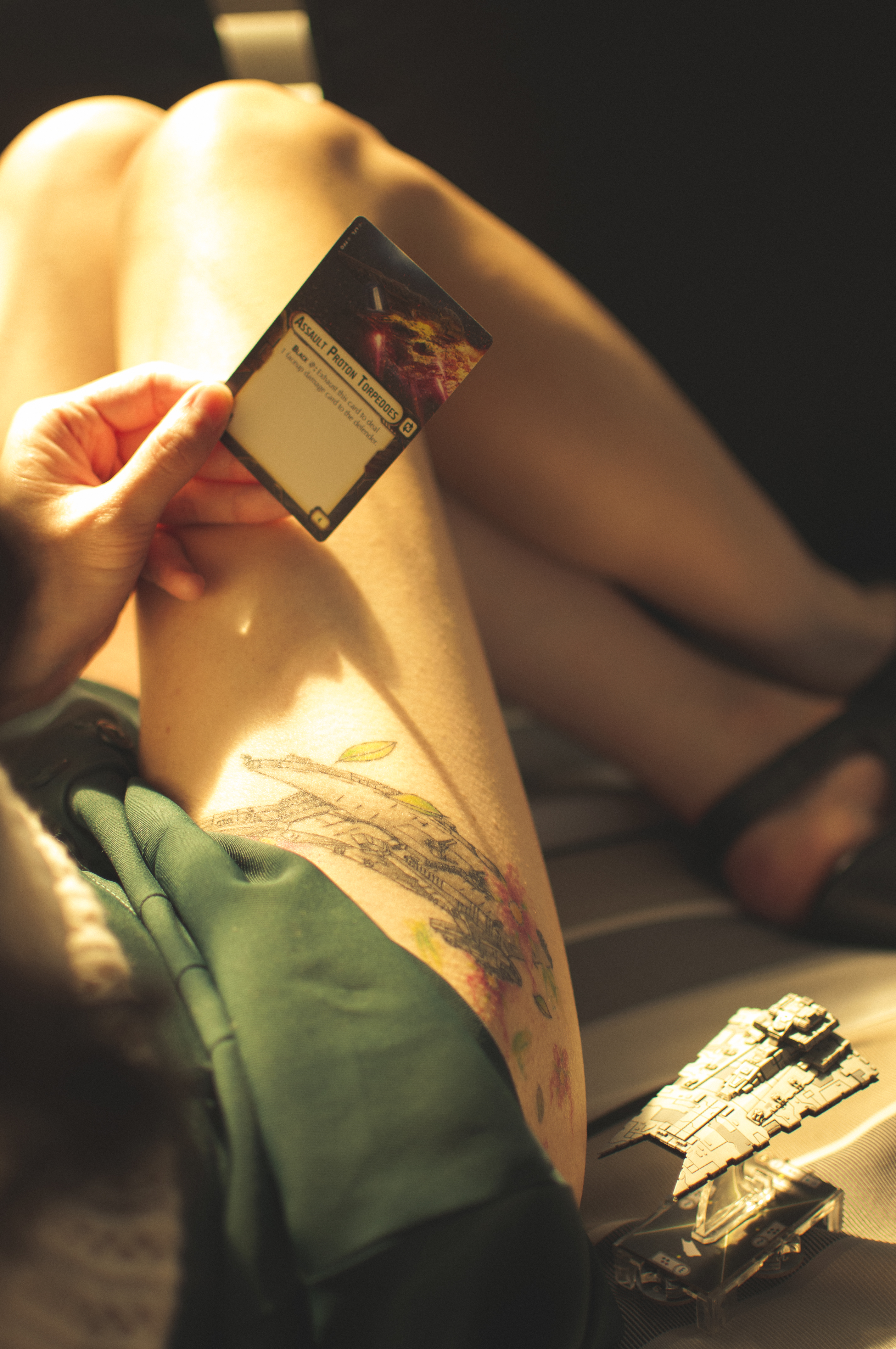a person holding a playing card