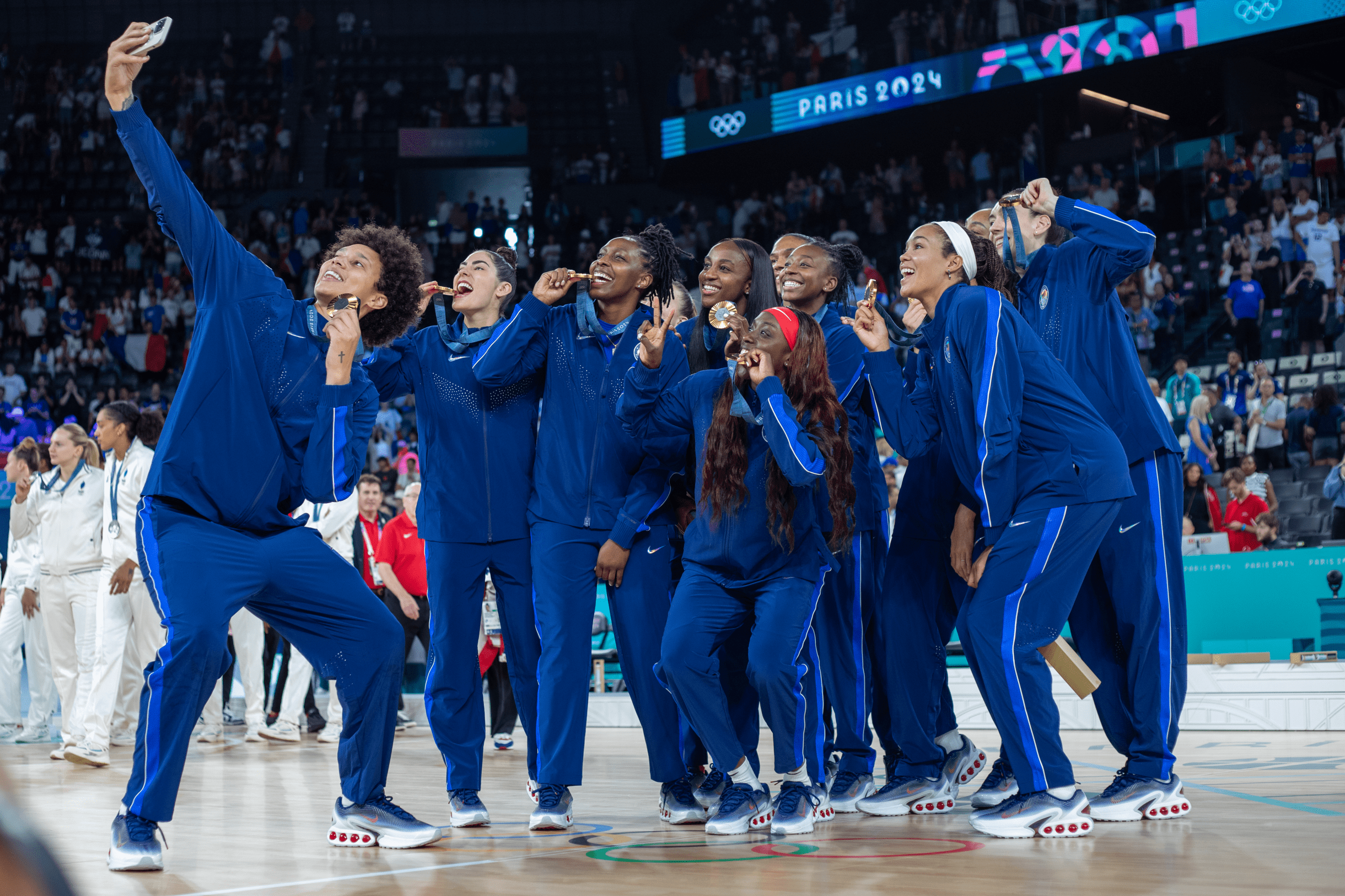 Olympic women's basketball team celebrates a gold medal