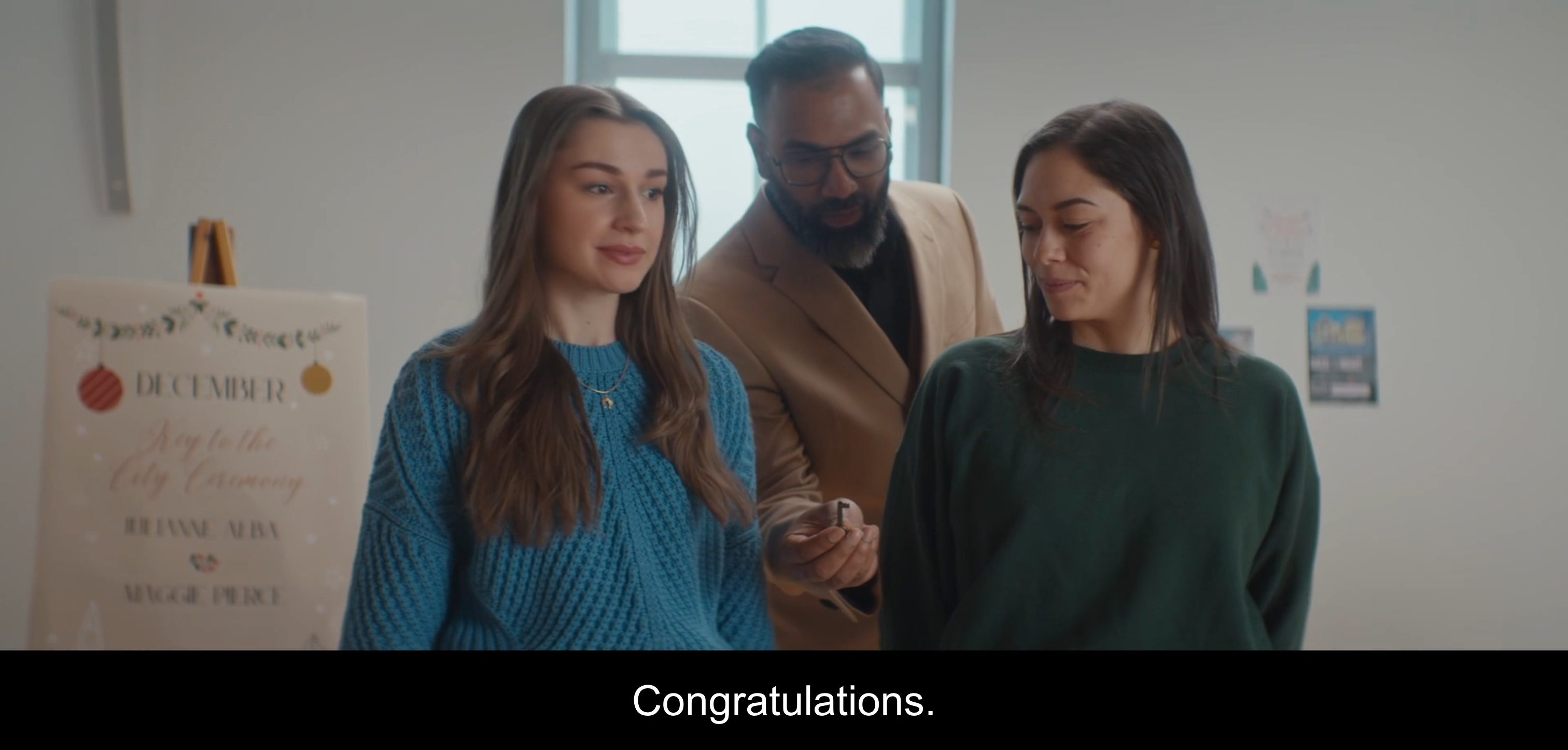 hands her a key "congratulations"