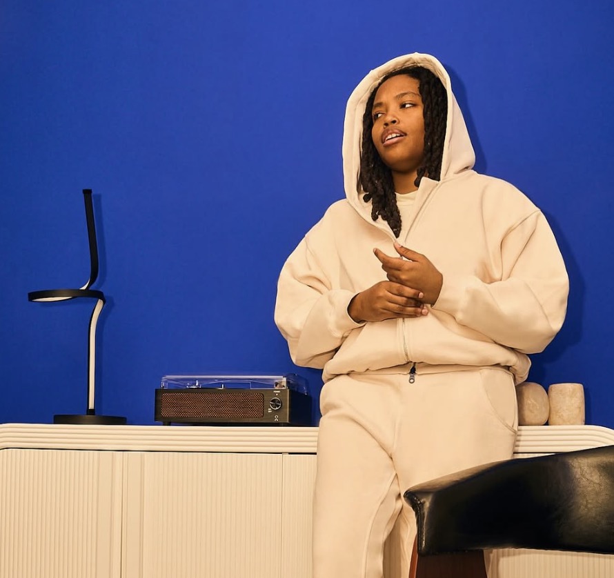 woman in cream colored sweatsuit