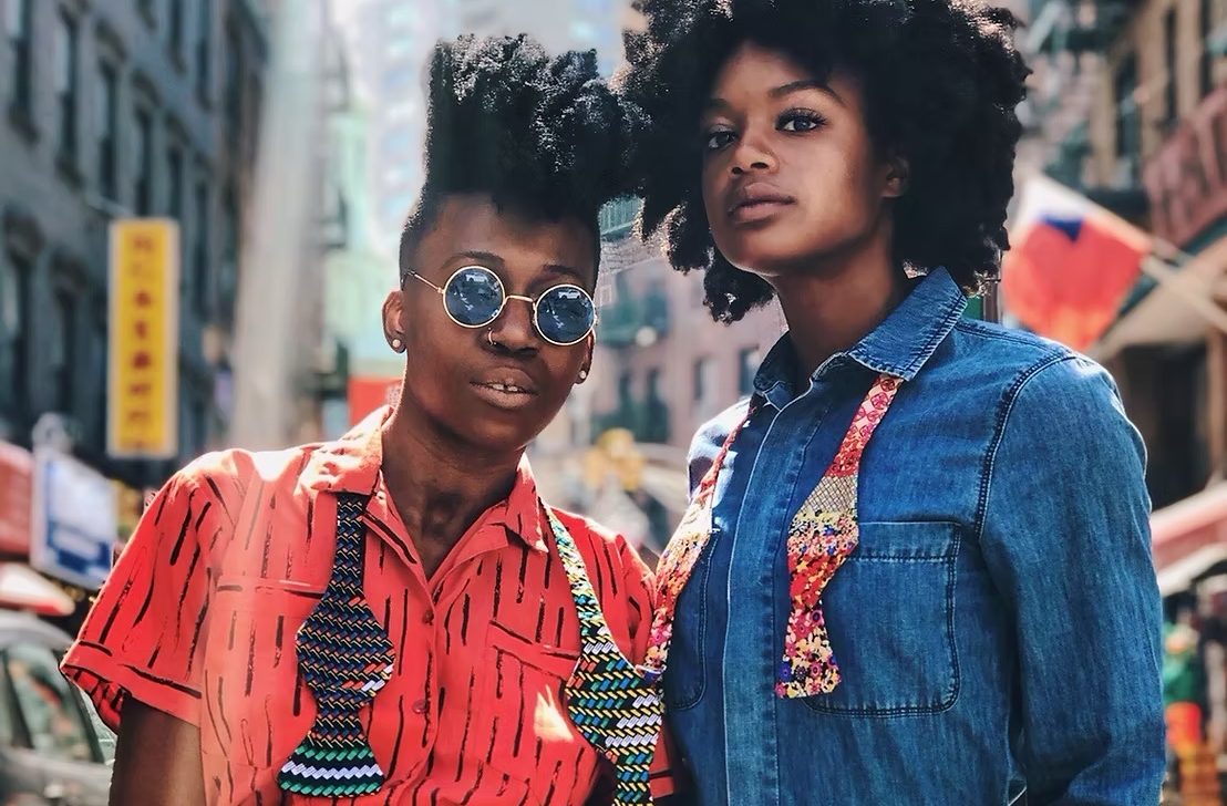 two women modeling bowties