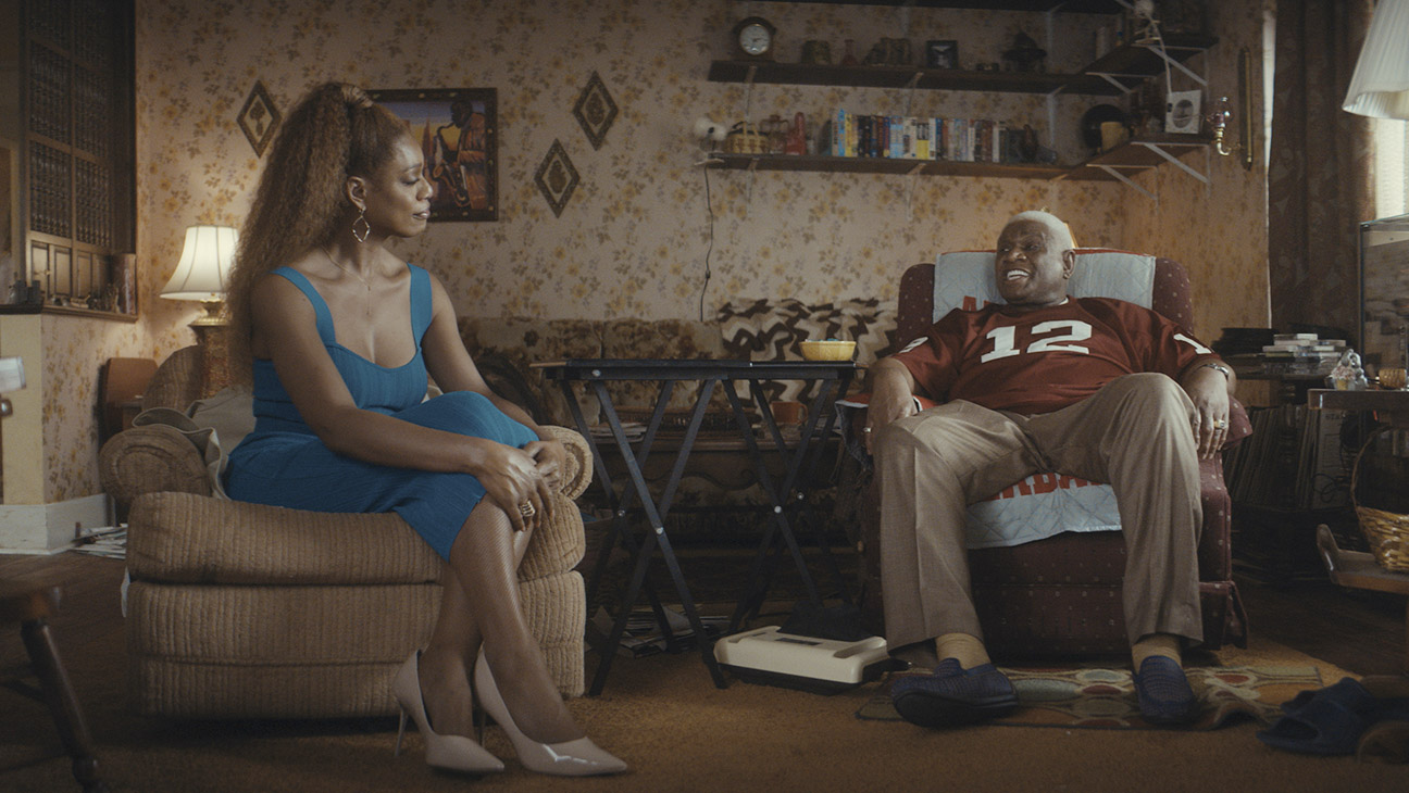 Desiree (Laverne Cox), Henry (George Wallace) sit in a living room