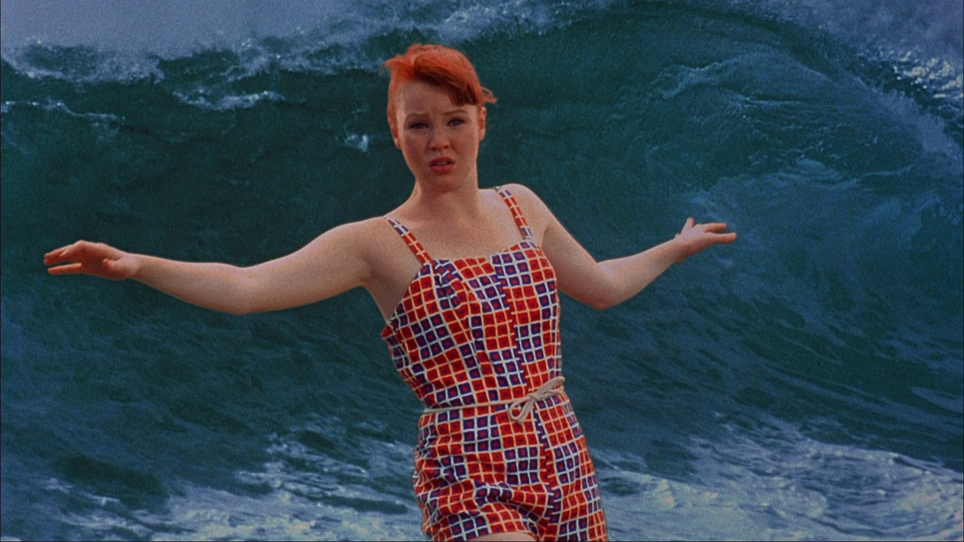 Lauren Ambrose surfs in Psycho Beach Party with an obvious green screen behind her.
