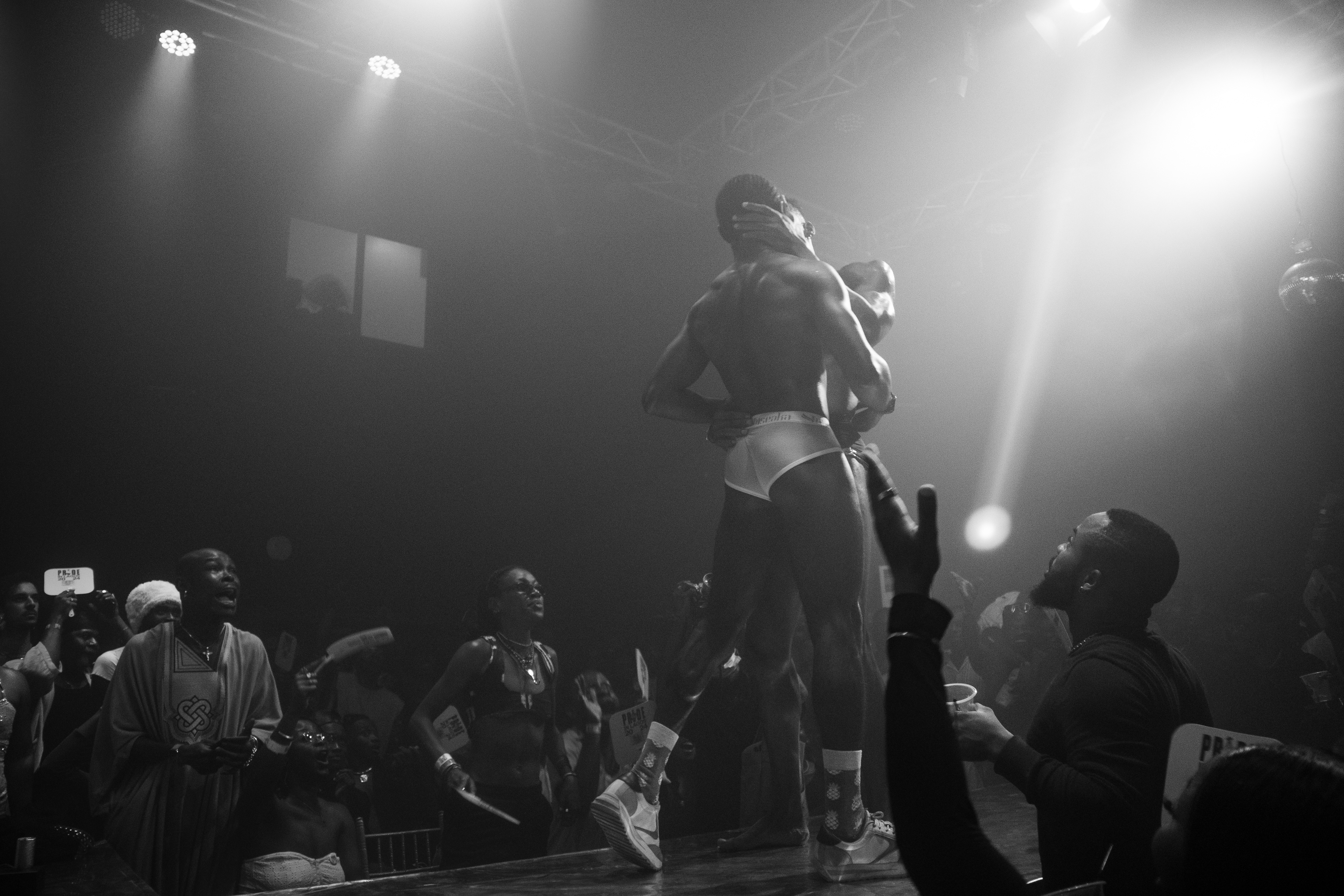 Heavenly Bodies performers embrace at the ballroom