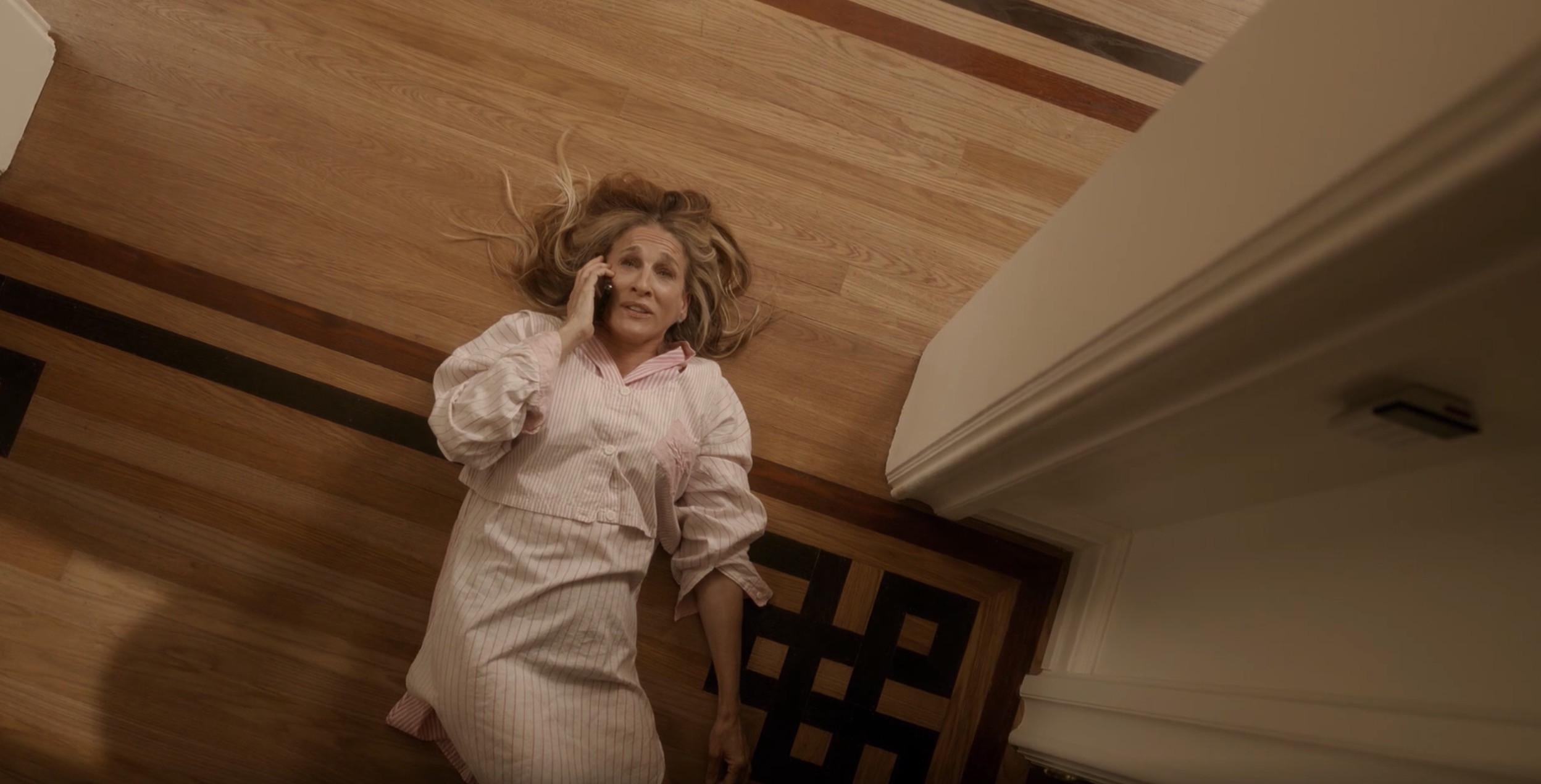 carrie lying on the ground on the phone