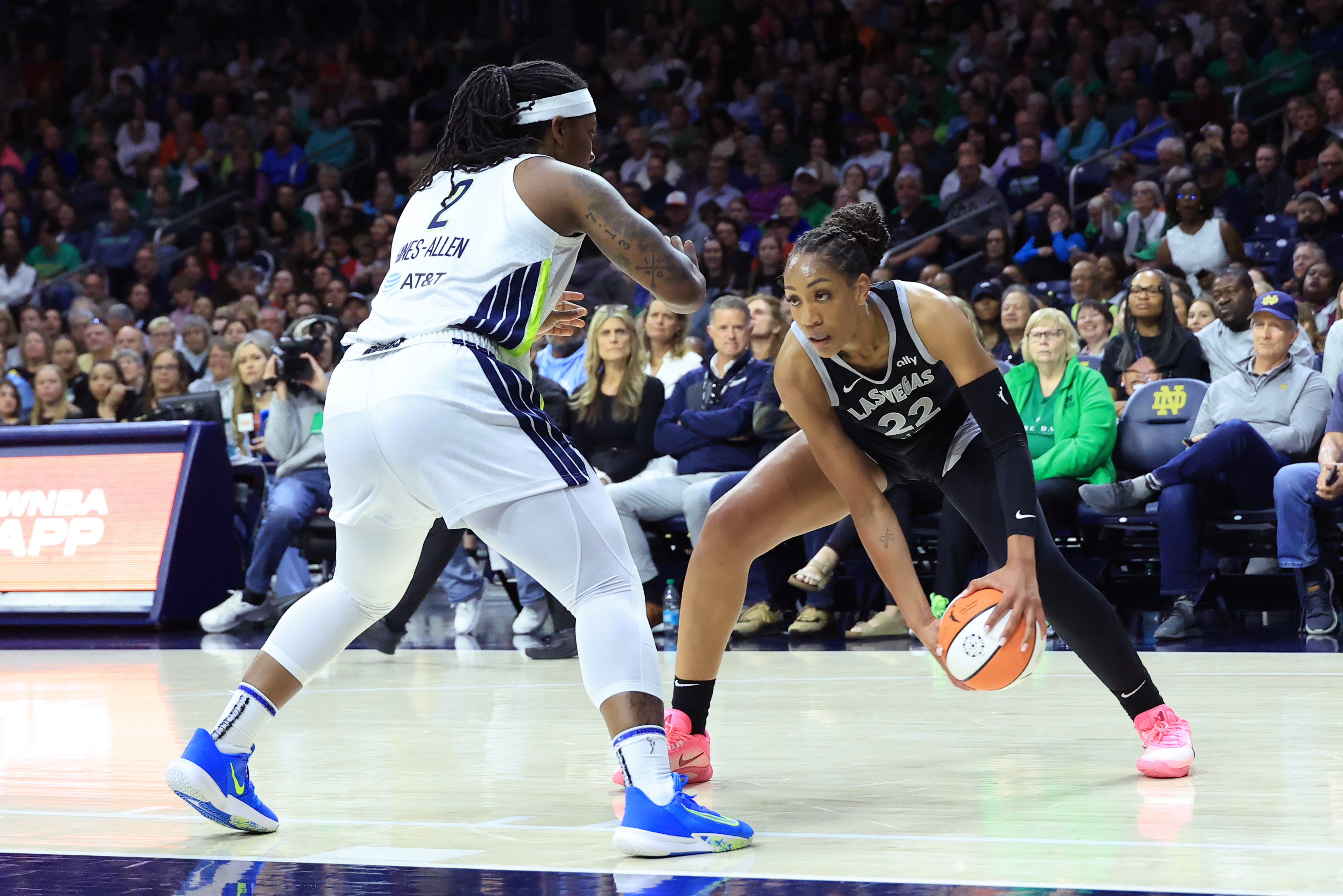 SOUTH BEND, INDIANA - MAY 02: A'ja Wilson #22 of the Las Vegas Aces makes a move on Myisha Hines-Allen #2 of the Dallas Wings during the second quarter during the preseason game at Purcell Pavilion on May 02, 2025 in South Bend, Indiana. NOTE TO USER: User expressly acknowledges and agrees that, by downloading and or using this photograph, User is consenting to the terms and conditions of the Getty Images License Agreement. (Photo by Justin Casterline/Getty Images)
