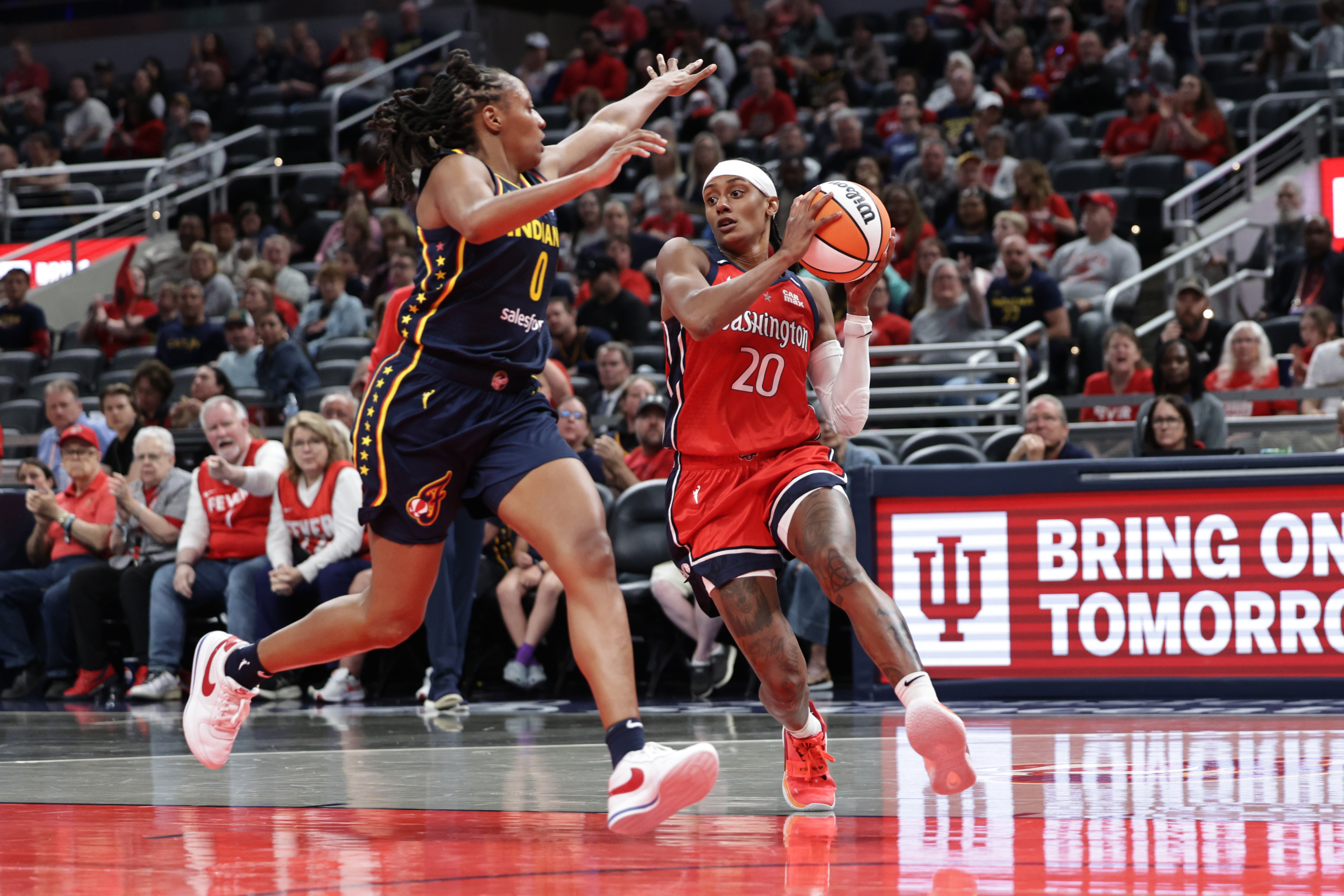 INDIANAPOLIS, INDIANA - MAY 3: Brittney Sykes #20 of the Washington Mystics dribbles past Kelsey Mitchell #0 of the Indiana Fever during the first half at Gainbridge Fieldhouse on May 3, 2025 in Indianapolis, Indiana. NOTE TO USER: User expressly acknowledges and agrees that, by downloading and or using this photograph, User is consenting to the terms and conditions of the Getty Images License Agreement. (Photo by Geoff Stellfox/Getty Images)