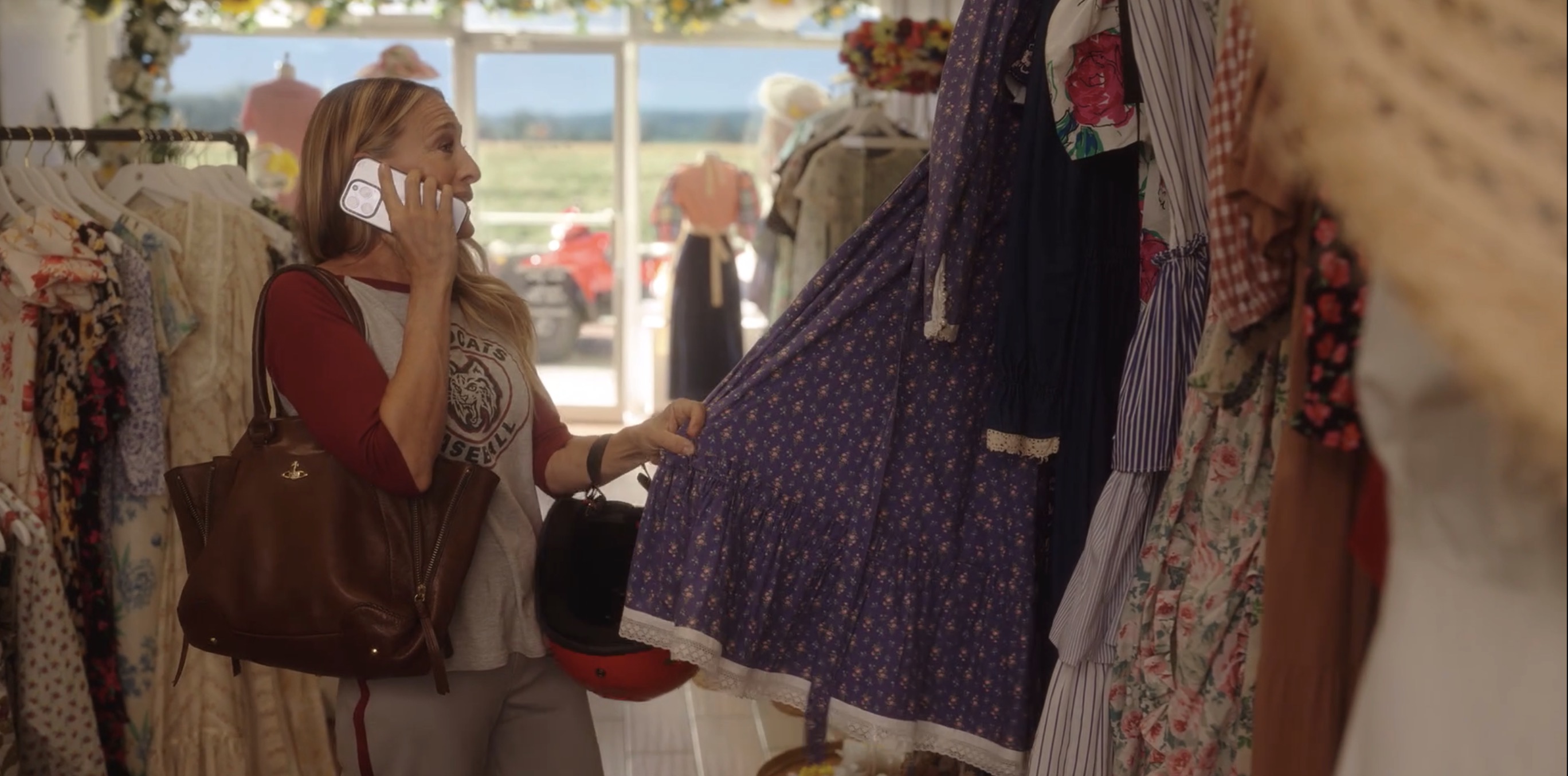 Carrie looking at a dress