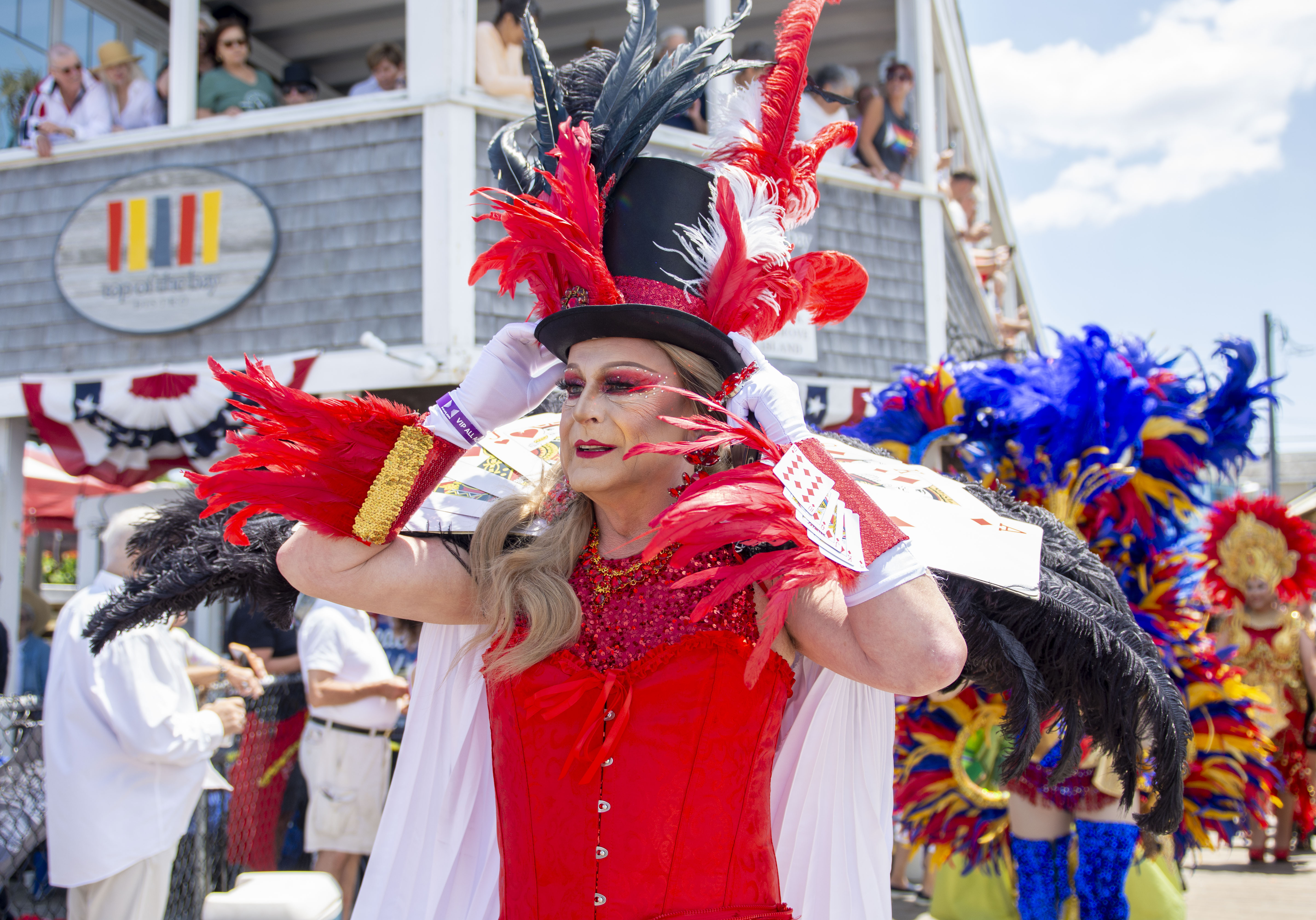 a drag queen in a mad hatter outfit