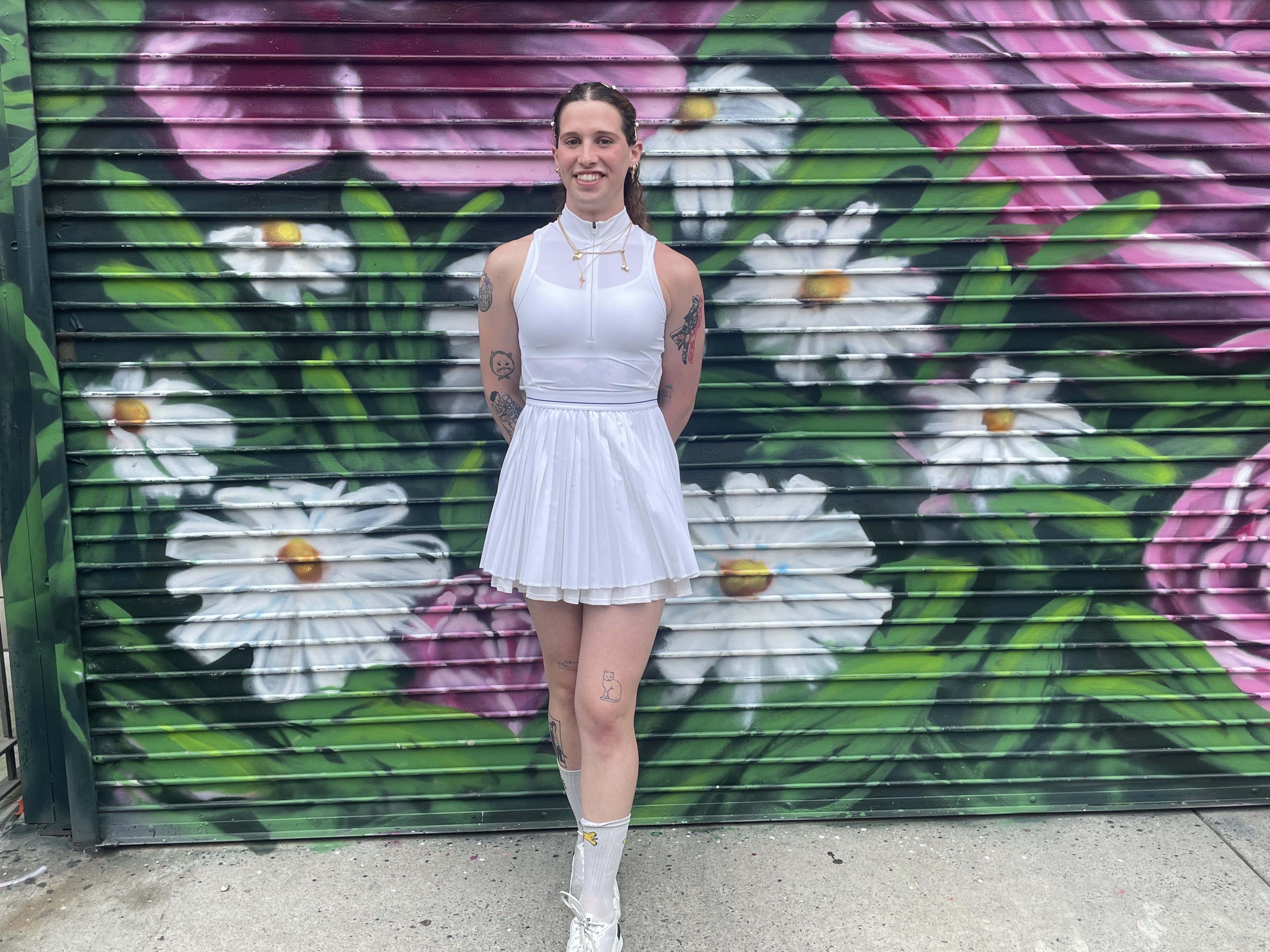 Cammie Woodman in a white tennis dress