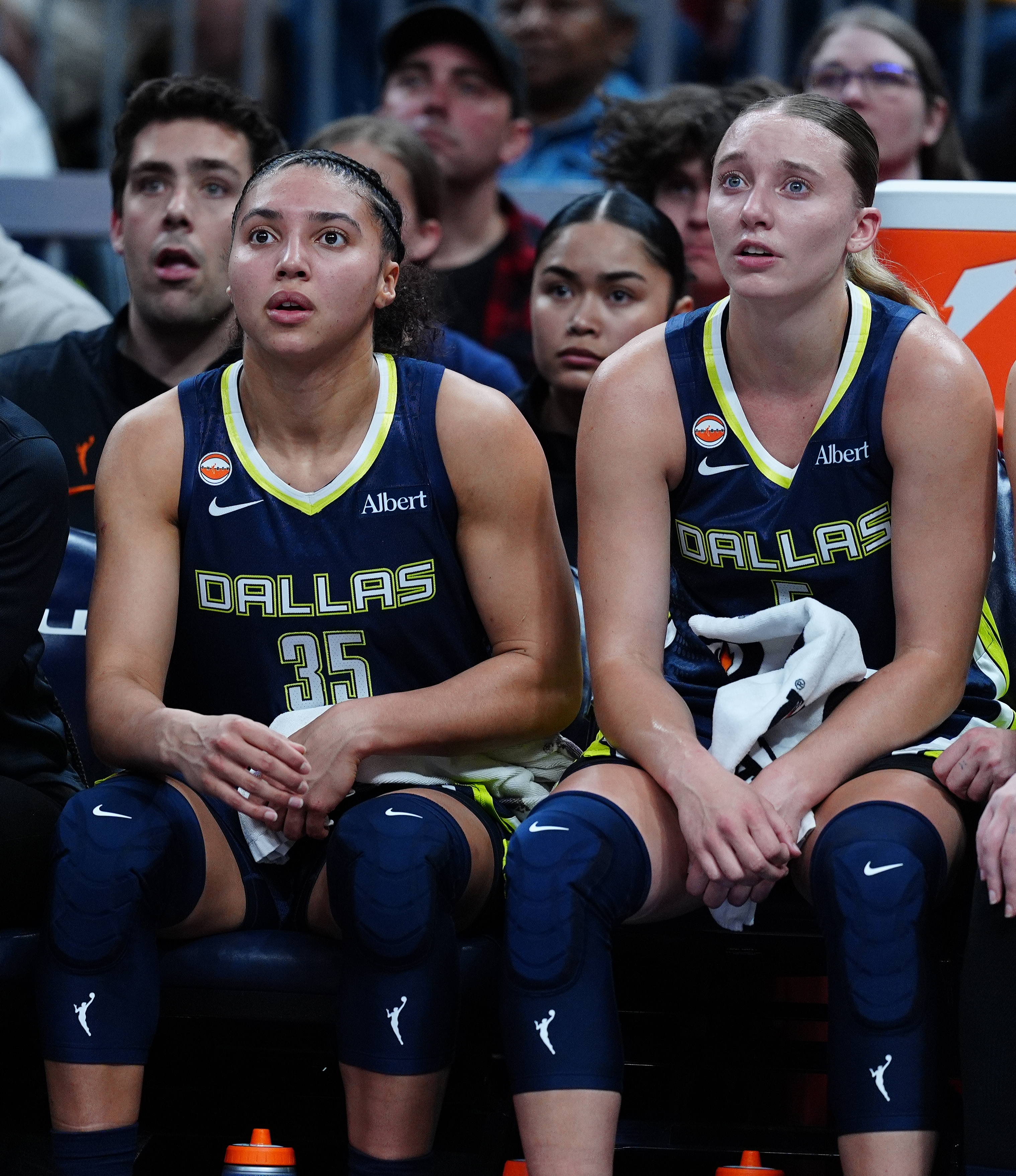 NDIANAPOLIS, IN - APRIL 30: From left to right Dallas Wings guards Azzi Fudd (35) and Paige Bueckers (5) watch from the bench during a preseason game against the Indiana Fever on April 30 at Gainbridge Fieldhouse in Indianapolis, Indiana.