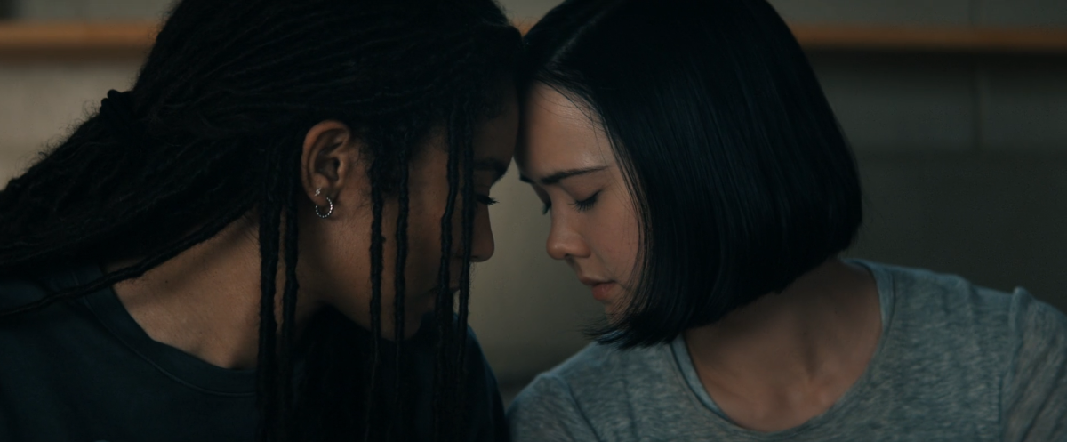 Marie and Jordan press foreheads together in a gay way