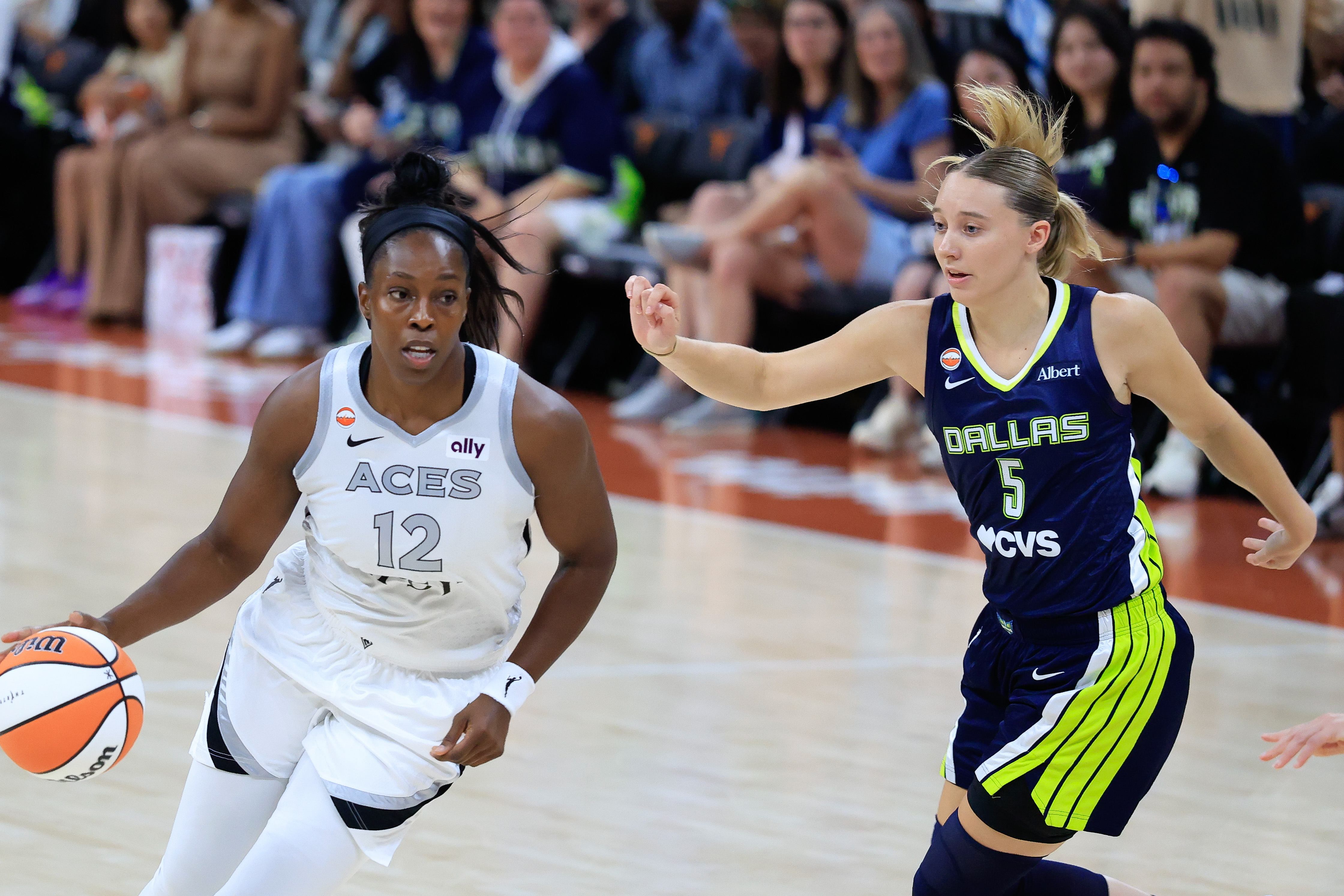 AUSTIN, TX - MAY 03: Las Vegas Aces guard Chelsea Gray #12 dribbles past Dallas Wings guard Paige Bueckers #5 during the game on May 03, 2026, at the Moody Center in Austin, TX. (Photo by Adam Davis/Icon Sportswire via Getty Images)