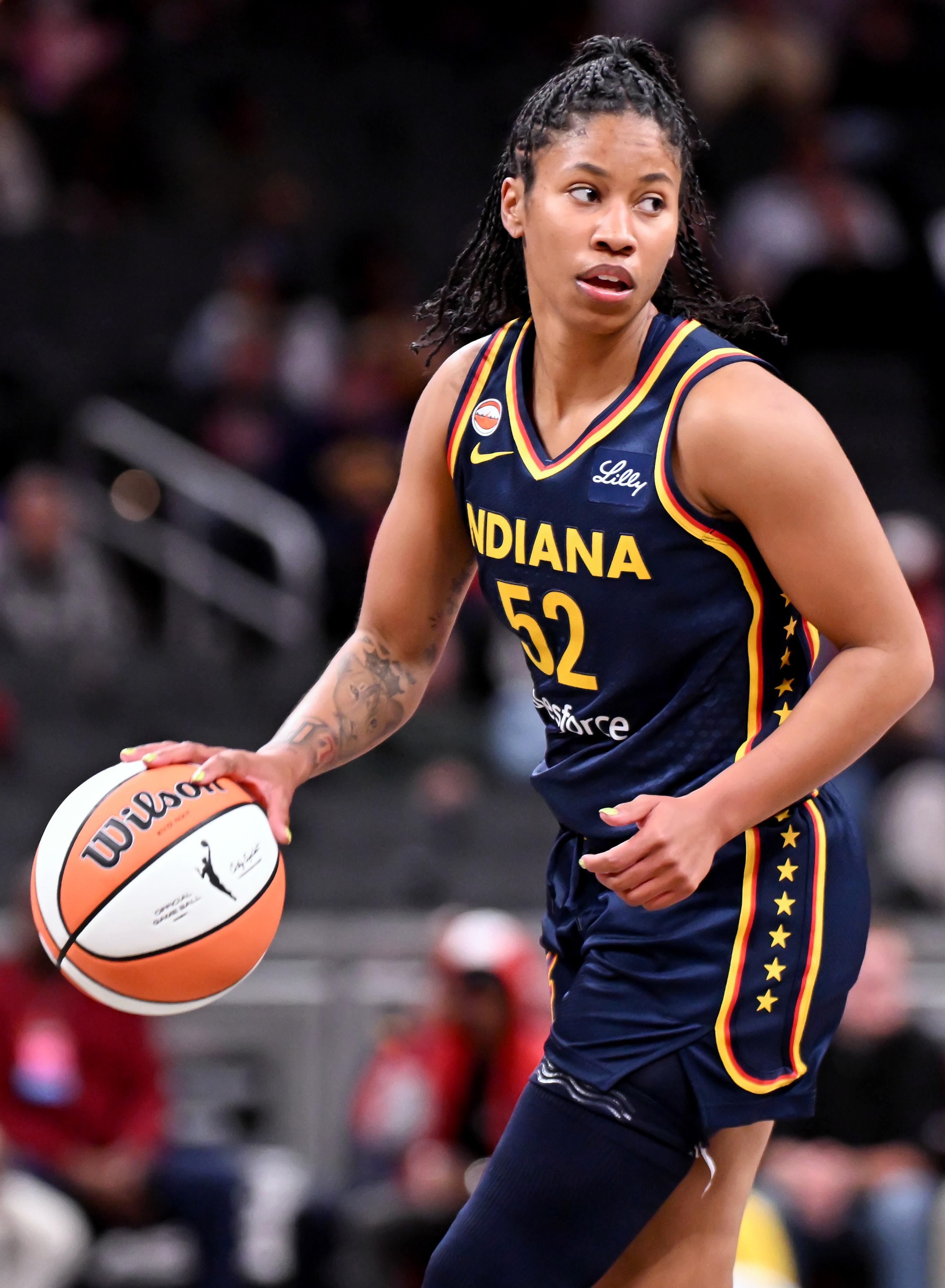 NDIANAPOLIS, INDIANA - MAY 02: Tyasha Harris #52 of the Indiana Fever dribbles against the Nigeria National Team during the first half at Gainbridge Fieldhouse on May 02, 2026 in Indianapolis, Indiana.