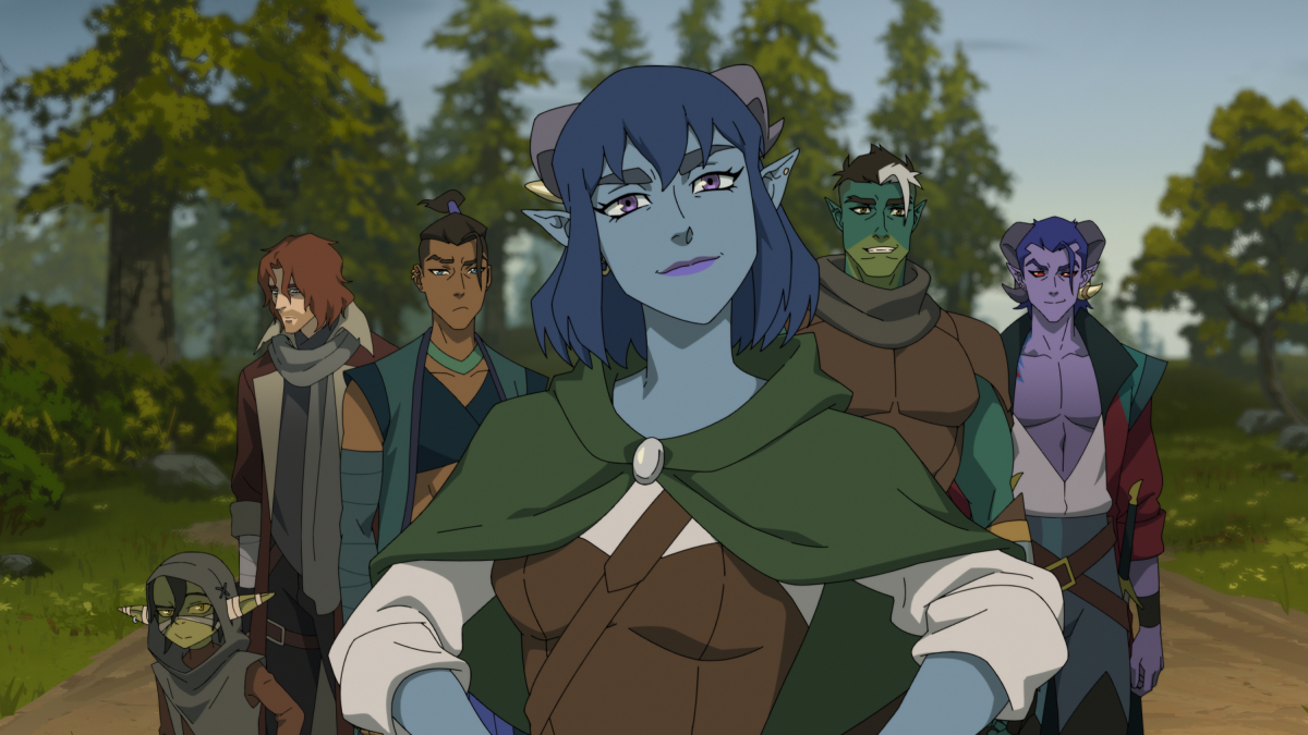 Six members of The Mighty Nein face "camera" with Jester standing front and center, hands on her hips, lips in a smirk.