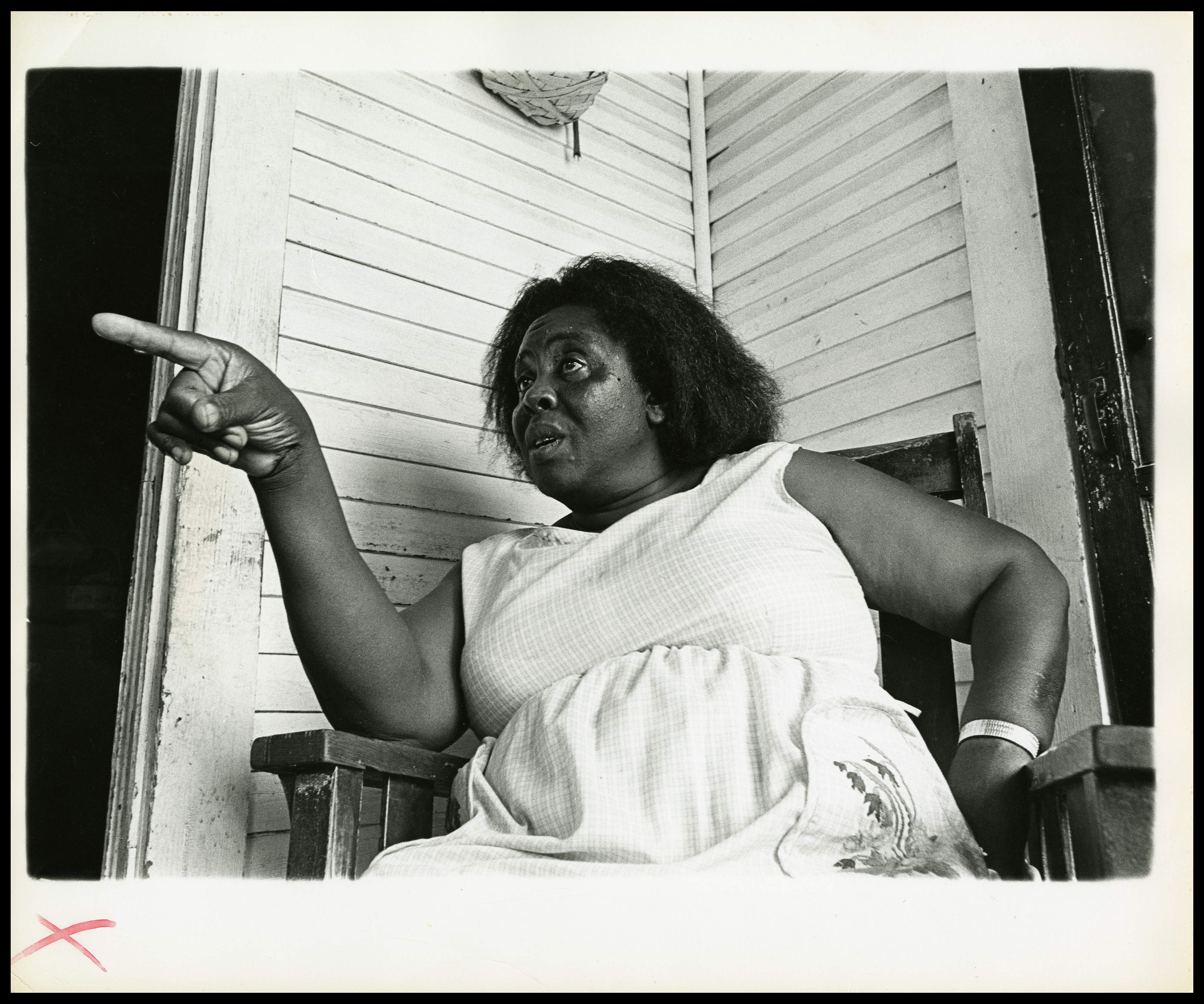 African American Activist, Fannie Lou Hamer, sitting on porch in white dress, pointing finger. Shot from waist up in Ruleville, Mississippi 1969. Photo is part of the Civil Rights collection. (Photo by Al Clayton/Getty Images)