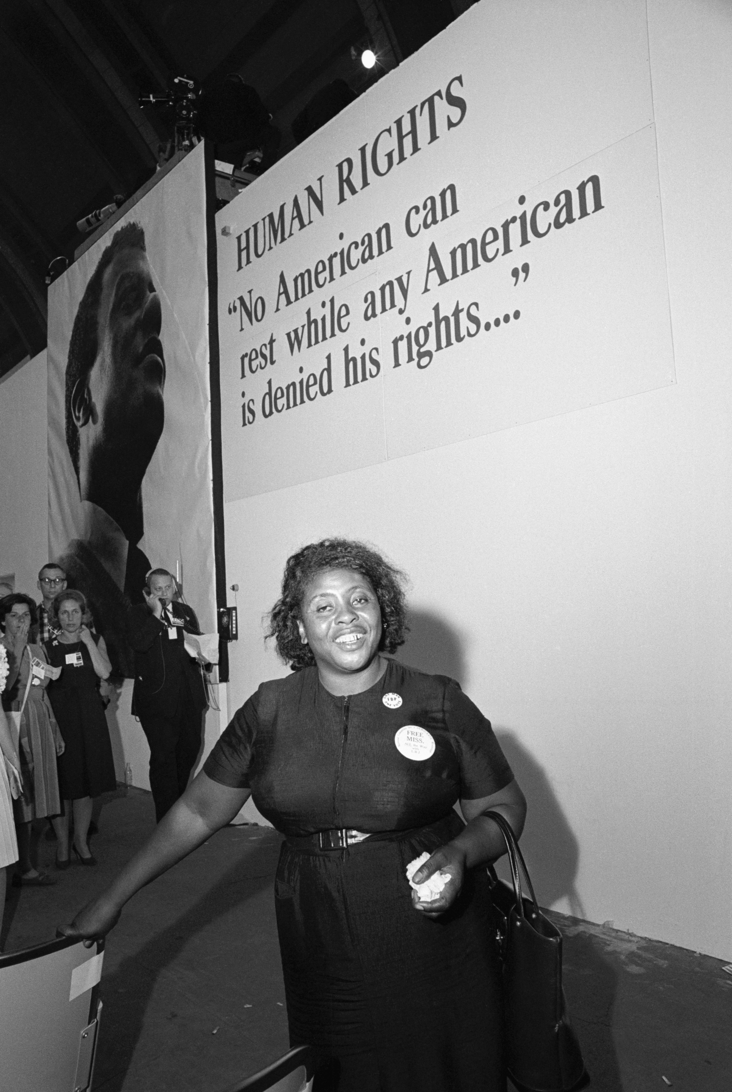 (Original Caption) 8/25/1964-Atlantic City, NJ- Convention Hall. Mrs. Fannie Hamer, member of the Mississippi Freedom Democratic Party, was one of the exciting highlights of the National Democratic Convention. Here, she walks firmly toward the convention hall entrance, to which she and other members of her group were finally admitted.