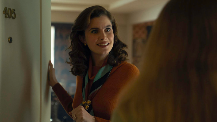 Ponies: Vic Michaelis as Cheryl, Cheryl is standing in the open doorway giving the woman standing there stankface